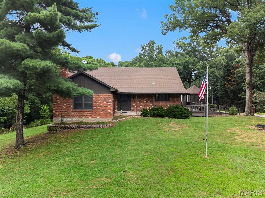 Escape the ordinary and discover the rare opportunity to own 30.54 acres of private, wooded wilderness in beautiful Augusta, Missouri. Whether you're searching for the perfect hunting getaway, a weekend retreat, a place to reconnect with nature, or the opportunity to build your dream home surrounded by privacy, 860 Schluersburg Road offers possibilities that are increasingly hard to find. Nestled among the trees is an adorable cabin-style home offering just under 1,700 square feet of living space. The main level features a spacious family room centered around a cozy wood-burning fireplace, a large eat-in kitchen with a charming bay window overlooking the property, main-level laundry, and a main-level owner's bedroom. In the family room and kitchen, you will find beatuiful, leaded glass windows that provide a bit of historic charm. Upstairs, you'll find two rustic bedrooms, a second full bathroom, and additional storage space. The unfinished walkout basement provides an opportunity to expand the living space and make the home your own. Outside, the property includes a detached two-car garage and metal shed, providing plenty of room for vehicles, equipment, recreational toys, or all the gear that comes with enjoying your own piece of the wilderness. Nature is truly the star of the show here. The property is abundant with wildlife, birds and the sights and sounds of the outdoors, offering privacy and tranquility in every direction. Spend your mornings exploring the acreage, evenings around the fire, weekends hunting, or simply enjoying the peace that comes with having more than 30 acres to call your own. The large deck and gazebo just off the house, provide a great place to take it all in. And when you're ready to trade the hiking boots for golf shoes, you're just minutes from the prestigious Boone Valley Golf Club, giving you easy access to one of the area's premier golf destinations while still enjoying the privacy and seclusion of your own private acreage. For those dreaming even bigger, this property offers a unique opportunity to start over and build your dream home in complete privacy, while keeping the existing cabin as a guest house, hunting lodge, weekend retreat, or whatever your imagination can dream up. Recently surveyed and ready for its next chapter, this is more than a property, it's an opportunity to create the lifestyle you've been looking for. 30.54 acres. A charming cabin. Abundant wildlife. Minutes from golf. Endless possibilities. Pure Missouri wilderness.