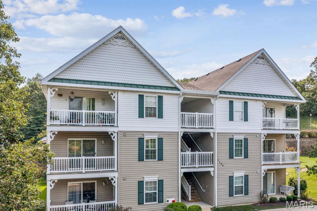 Enjoy easy, low-maintenance living in this well-appointed 2-bedroom, 2-bath condo in the Arbor Creek community, established in 2003. Unit 2A is located on the second floor, yet offers convenient STEP- FREE entry when parking on the east side of the building, plus an assigned space (#40) beneath the COVERED PARKING pavilion.

Inside, cherry-toned laminate flooring, crown molding and interior shutters add warmth and character to the bright, open floor plan. The kitchen flows easily into the dining and living areas and includes a newer dishwasher, while a coat closet near the entry provides welcome everyday storage.

The popular split-bedroom layout offers privacy for both residents and guests. The spacious primary suite features a walk-in closet with shoe racks and a private bath with a double-sink vanity, low-step shower, built-in bench and safety handles. A second bedroom and full hall bath provide flexible space for guests, an office or hobbies.

Sliding glass doors open to the private deck, complete with electrical access and its own storage closet. Additional conveniences include a stackable washer and dryer, newer windows with screens provided through the HOA, included window treatments and an air-conditioning system installed in 2021.

With comfortable one-level living, thoughtful accessibility features and easy access to shopping, dining, parks and major highways, this inviting condo offers a practical and appealing West County lifestyle in the Parkway South School District.