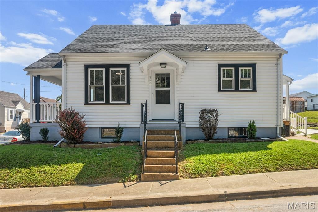 The charm you want. The features you need. And character you simply can’t recreate.

Welcome to 700 S. Benton, where the craftsmanship and personality of a classic St. Charles home meet comfortable, thoughtfully styled living spaces.

Step inside and you’ll immediately see what makes this home different. Original hardwood floors, rich wood doors and trim, glass knobs and vintage details preserve the home’s history, while carefully selected finishes complement how we live today. You’ll even discover a few unique reminders of another era—the kinds of details that give an older home its story.

The kitchen brings together style and function with attractive cabinetry, solid-surface countertops, coordinating backsplash, newer LG appliances, a higher-end gas range, recessed lighting and distinctive fixtures. Ceiling fans and dimmers throughout the home add comfort and flexibility.

Both bathrooms have been beautifully styled, with attention given to every selection. The main-level bath features striking marble-look tile, a coordinating vanity, fixtures and finishes. Upstairs, the primary suite creates a private retreat with its own spacious bath featuring a tiled walk-in shower, contemporary vanity and fixtures. Additional space beneath the architectural roofline offers possibilities for built-in storage, a dressing area or future customization.

New double-hung, tilt-in windows offer easy cleaning, while the exceptionally clean basement provides additional storage and utility space.

Outside, refreshed landscaping and landscape lighting complement the crisp white exterior and contrasting trim. Multiple outdoor spaces add to the home’s charm, including a covered porch just waiting for your favorite chair and morning coffee. Off-street parking adds everyday convenience.

Perhaps the best part is that the home’s personality remains intact. Original wood floors, doors, trim and vintage touches come together with beautifully styled kitchens, baths, lighting and finishes to create something increasingly difficult to find: an older home that still feels like an older home—just thoughtfully brought forward.

Come experience the details in person. This is one of those homes where the closer you look, the more there is to appreciate.

Some images have been virtually staged.