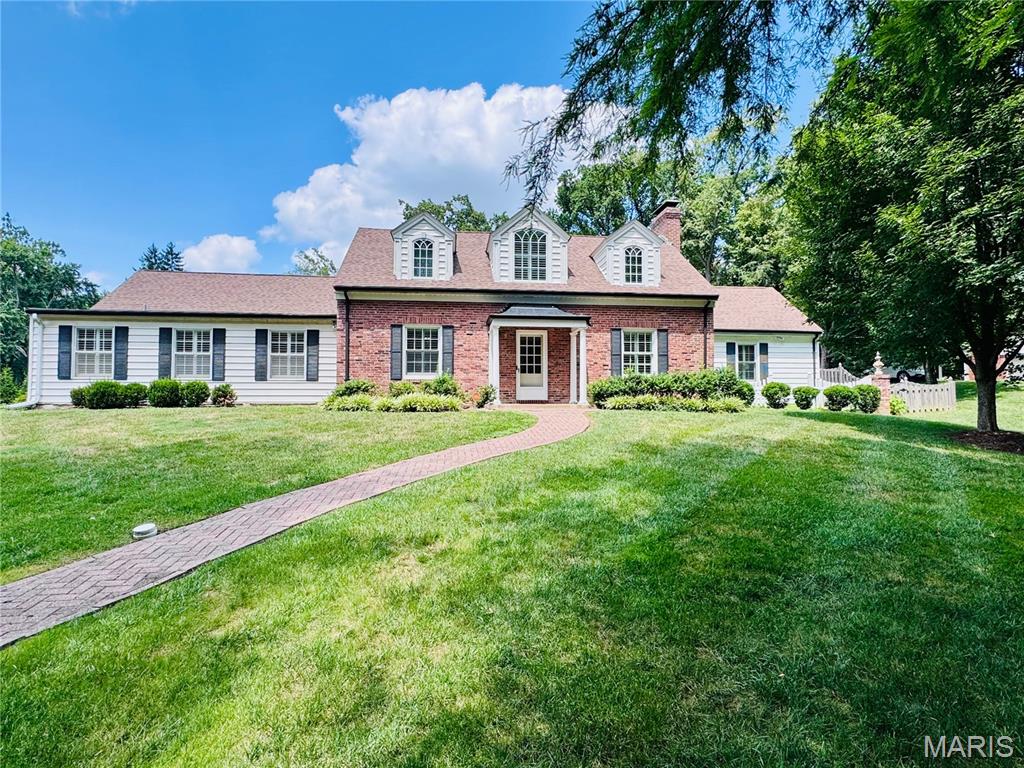Nestled on one of Ladue's most private and sought-after streets, this beautifully maintained 4-bedroom, 3-bath residence offers the perfect blend of timeless elegance, everyday comfort, and exceptional outdoor living. Set on over a half-acre of meticulously landscaped grounds, this home is a rare opportunity in the heart of one of St. Louis' most prestigious communities.

Step inside to discover exquisite hardwood floors throughout, thoughtfully updated bathrooms, and a spacious, light-filled floor plan designed for both everyday living and effortless entertaining. The expansive main-floor primary suite is a true retreat, featuring a generous walk-in closet and a beautifully appointed en suite bath. A convenient main-floor laundry room adds to the home's functional appeal.

Upstairs is accompanied by three generously sized bedrooms that offer comfort and flexibility for family and guests alike.

The backyard is nothing short of spectacular. Enjoy your own private oasis with a completely remodeled gunite saltwater pool, renovated just four years ago with elegant limestone finishes and cool-deck concrete—creating the ultimate setting for summer entertaining or peaceful relaxation. A rear-entry two-car garage preserves the home's curb appeal while providing easy access, and the expansive driveway offers abundant parking with plenty of room for kids to shoot hoops, neighborhood basketball games, or additional guest parking.

Combining privacy, an unbeatable location, exceptional outdoor living, and award-winning Ladue Schools—including Reed Elementary—this is a rare opportunity to own a move-in-ready home in one of Ladue's most desirable neighborhoods.