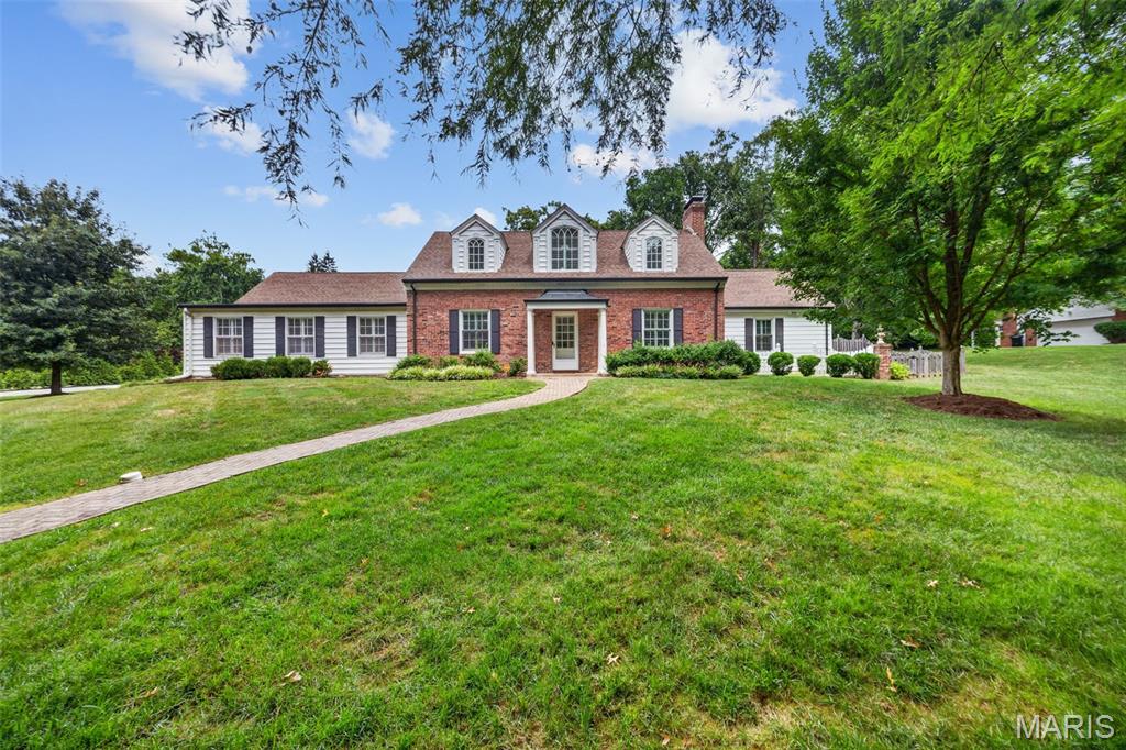 Nestled on one of Ladue's most private and sought-after streets, this beautifully maintained 4-bedroom, 3-bath residence offers the perfect blend of timeless elegance, everyday comfort, and exceptional outdoor living. Set on over a half-acre of meticulously landscaped grounds, this home is a rare opportunity in the heart of one of St. Louis' most prestigious communities.

Step inside to discover exquisite hardwood floors throughout, thoughtfully updated bathrooms, and a spacious, light-filled floor plan designed for both everyday living and effortless entertaining. The expansive main-floor primary suite is a true retreat, featuring a generous walk-in closet and a beautifully appointed en suite bath. A convenient main-floor laundry room adds to the home's functional appeal.

Upstairs is accompanied by three generously sized bedrooms that offer comfort and flexibility for family and guests alike.

The backyard is nothing short of spectacular. Enjoy your own private oasis with a completely remodeled gunite saltwater pool, renovated just four years ago with elegant limestone finishes and cool-deck concrete—creating the ultimate setting for summer entertaining or peaceful relaxation. A rear-entry two-car garage preserves the home's curb appeal while providing easy access, and the expansive driveway offers abundant parking with plenty of room for kids to shoot hoops, neighborhood basketball games, or additional guest parking.

Combining privacy, an unbeatable location, exceptional outdoor living, and award-winning Ladue Schools—including Reed Elementary—this is a rare opportunity to own a move-in-ready home in one of Ladue's most desirable neighborhoods.