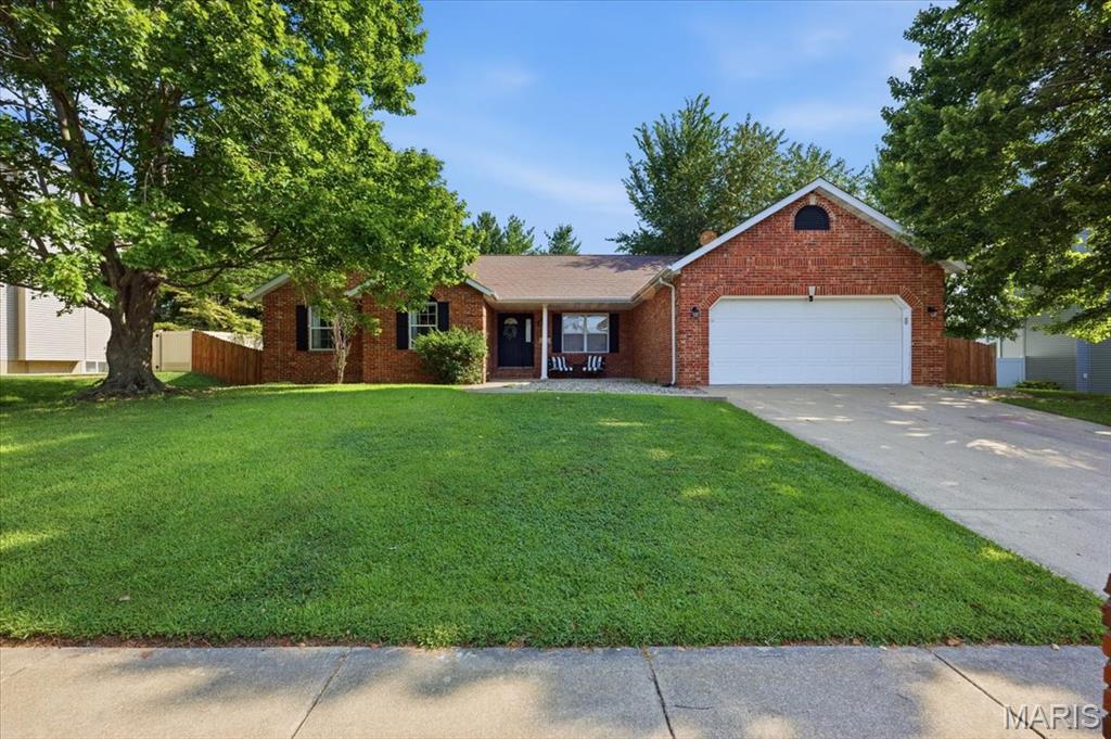 This spacious 3-bedroom, 3-bath ranch offers an inviting open layout, beautifully updated spaces, and plenty of room to spread out both inside and out. Step into the bright living room featuring vaulted ceilings, warm wood flooring, and an easy flow into the dining area and kitchen. The updated kitchen is a standout with white cabinetry, solid-surface countertops, subway tile backsplash, stainless steel appliances, abundant counter space, and a large breakfast bar.

The primary suite features a vaulted ceiling and private bath with a double vanity and walk-in shower. Two additional bedrooms, another full bath, and flexible living spaces complete the main level.

Downstairs, the partially finished basement significantly expands the home's usable space with a large recreation area, bonus room, and full bath, while the unfinished portion provides excellent storage and additional possibilities.

Outside, enjoy a large fenced backyard with plenty of room for outdoor activities and entertaining. A covered deck and patio create a comfortable spot to relax, dine, or gather with guests. An attached 2-car garage completes the package.