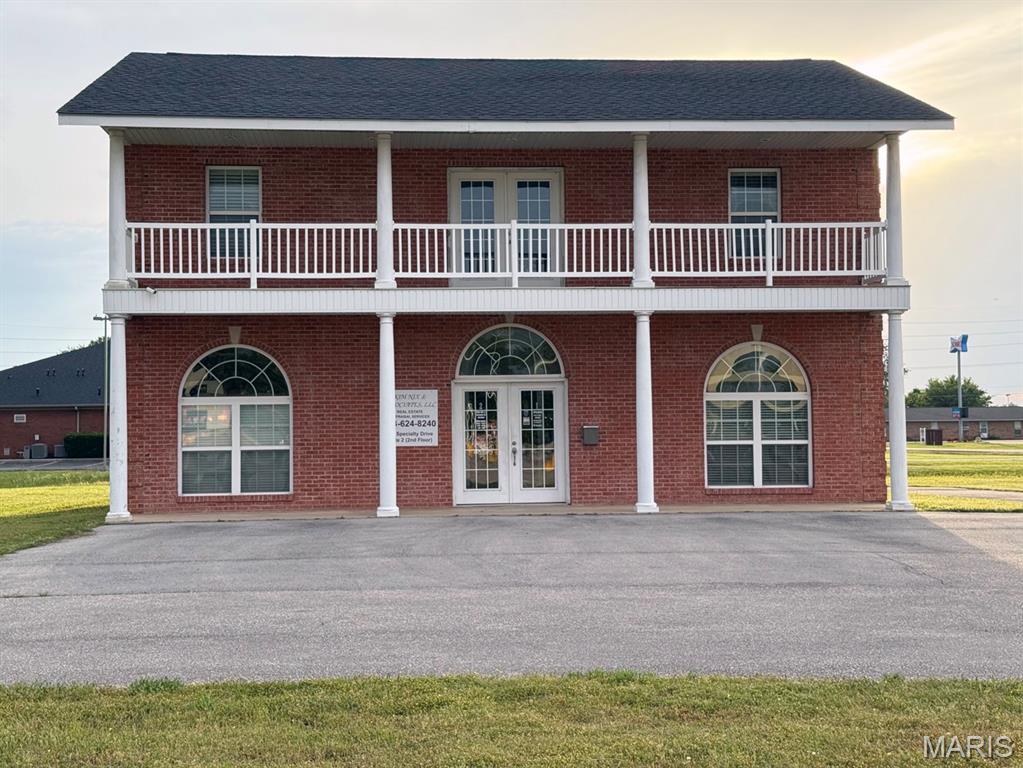 Exceptional opportunity to own a versatile two-story brick commercial building offering approximately 1,499 SF per level. The main floor features impressive 10-foot ceilings, five private offices, a conference room, kitchenette, and half bath—creating an ideal layout for professional, medical, administrative, or multi-business use.  The upper level provides additional flexibility with four private offices, a three-quarter bath with separate shower and space for a stackable washer and dryer, a full kitchen, and abundant natural light from large windows throughout. The functional floor plan allows for a variety of business configurations, including owner-occupant, multi-tenant, live/work, or investment opportunities.