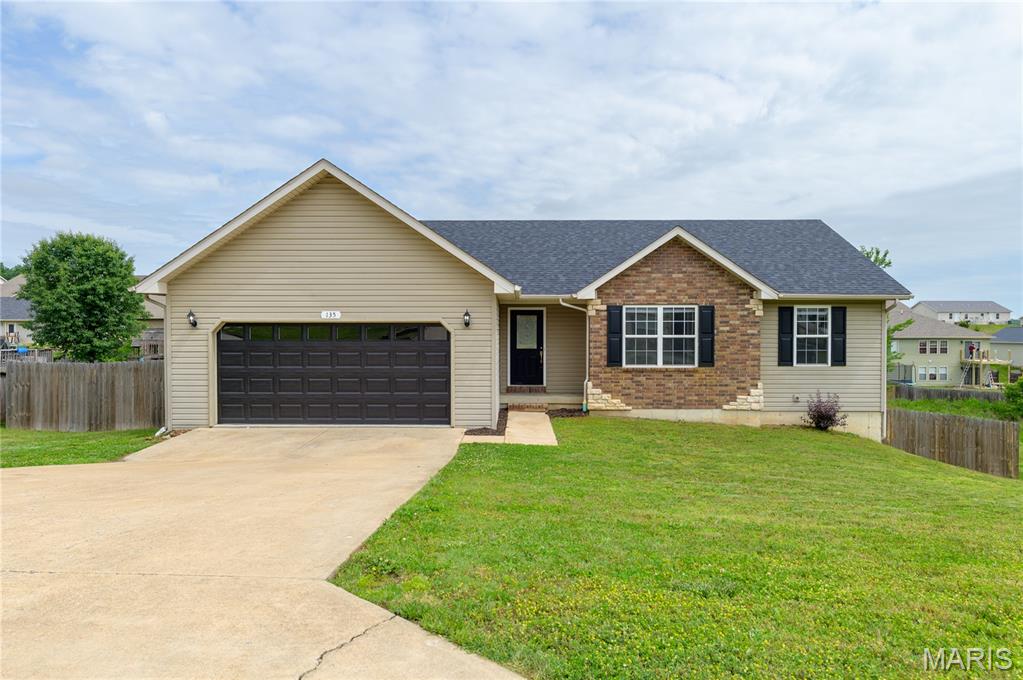 This beautiful 4 bedroom, 3 bathroom home is located in the desirable Wood Land Hills subdivision with convenient access to Fort Leonard Wood and is situated within the Waynesville School District. This home has been very well cared for and has a NEW ROOF and hot water tank both installed in 2024. 
Step inside through the foyer into the spacious open-concept living room featuring luxury vinyl plank flooring and a cozy gas fireplace. The updated kitchen offers stainless steel appliances, white cabinetry, solid surface countertops, an under-mount sink, and a center island perfect for gathering and entertaining. Just off the kitchen, step out onto the back deck overlooking the LARGE fenced-in backyard.
The main level also includes a laundry room, a spacious primary suite with a walk-in closet and private bathroom, plus two additional bedrooms and a full guest bathroom.
Downstairs, the finished lower level features a HUGE family room, an additional bedroom and bathroom, a bonus room perfect for an office or flex space, and plenty of storage. The Seller is willing to change out the carpeting throughout the home or provide a flooring allowance so the new Buyer can pick out what they want. 
Move-in ready and full of space both inside and out, this home is ready for its next family. Schedule your showing today!