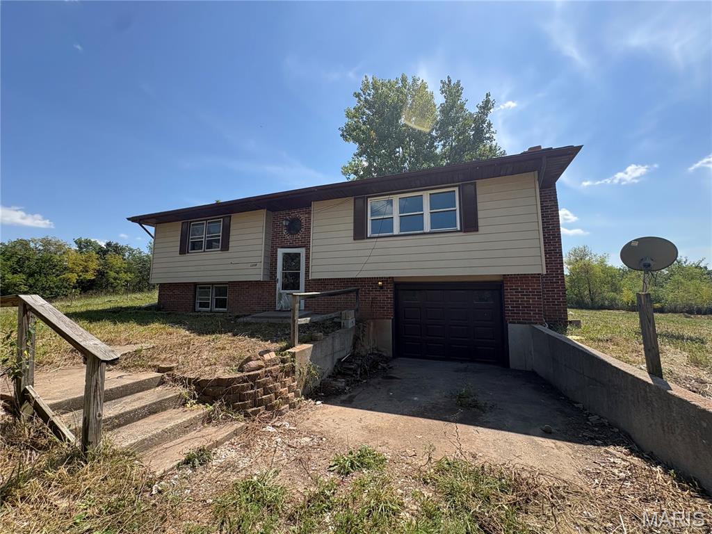 Enjoy the space, privacy, and potential this 2-bedroom, 2-bath split-foyer home has to offer, situated on approximately 2 acres with beautiful lakeside views! With nearly 1,900 square feet of living space, the home provides a flexible layout with plenty of room to make it your own. The fully finished lower level adds two additional sleeping areas, expanded living space, and a convenient one-car garage. Whether you're looking for extra room for guests, a home office, recreation space, or simply more room to spread out, this property offers plenty of possibilities. The acreage and scenic setting provide an added bonus that's hard to find, while the existing layout gives you a great starting point to bring your vision to life. Being sold as-is, this is an excellent opportunity for a buyer looking for space, views, and potential.