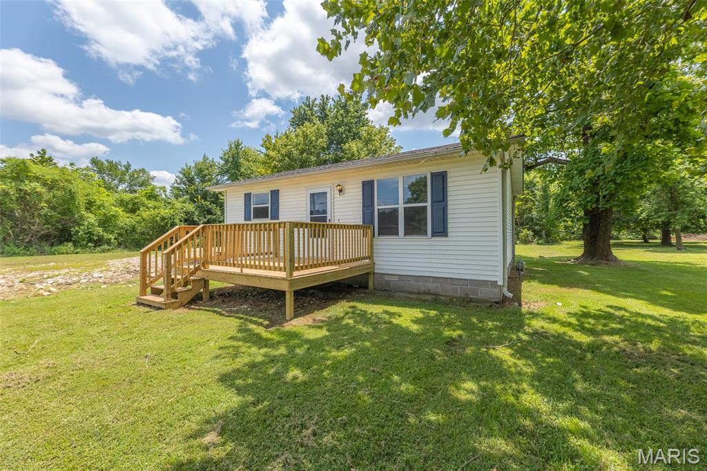 Newly remodeled 1 bed 1 bath house, perfectly located for ample opportunities! Situated on roughly 1.4 acres (survey provided), this property also boast public water and sewer, making it perfect for development opportunities, or simply a small homestead! Call today!
