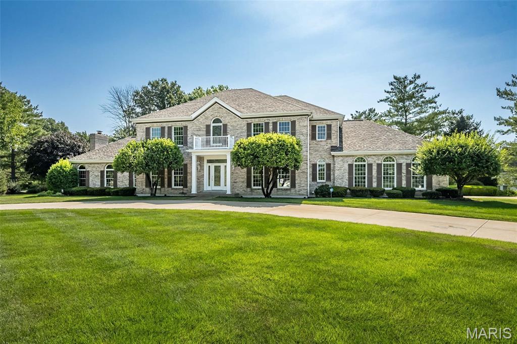 Located in Dunhill, the circle drive and beautiful curb appeal welcome you home.  Leaded glass entry doorleads to a 2 story foyer with hardwood flooring.  There is extensive crown molding, palladian and transom windows add architectural flair.  The game room addition could be an amazing man cave that's not a cave at all, flooded with nautral light and a gas fireplace for cooler days.  The family room has another fireplace, built in shelves, transom windows, wet bar and hardwood floring.  You'll love spending time in the kitchen with an inviting 4 season room to enjoy every seaon.  A rear stair leads to the second level, with hardwood flooring running the hall and into the primary suite. Rest and relax! Tray ceilin,g ensuite bath with tub, separate shower and a commode room complete with a bidet.  2 additional bedrooms share a jack and jill bath, the 4th bedroom is ensuite, a second primary suite guests or your favorite child!  The lower level is versatile, with a huge office space, a rec room with fireplace and a walk behind bar.  There's a cedar closet, a hobby room and a workshop area, definitely room for everyone and enverything here!  The brick patio spans the back of the house and overlooks lush landscaping and a gorgeous yard. This beautiful Clarkson Valley home has easy access to all that Chesterfield Valley has to offer.  Rockwood schools, award winning Kerhs Mill Elementary, and easy highway access.  New roof August this year, inground sprinkler system.