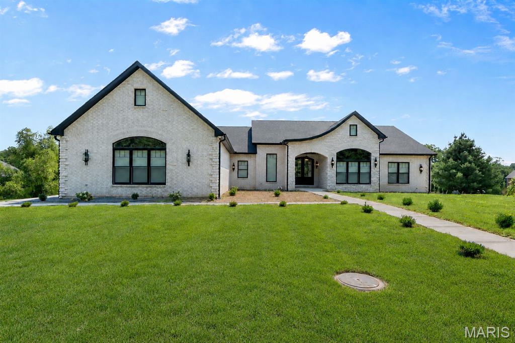 Completed in January 2026, this exceptional custom-built six-bedroom home offers an extraordinary blend of luxury, comfort, and thoughtful design.

Featuring two designer kitchens, premium appliances, a spacious butler’s pantry, Southfork designer lighting, custom Roman shades, hidden spaces throughout, and Bluetooth-enabled bathroom fans, every detail was carefully selected to elevate everyday living.

The private primary suite offers a spa-inspired walk-in shower and an expansive custom walk-in closet designed for both beauty and function.

One of the home’s most impressive features is the five oversized garages, providing exceptional space for vehicles, recreational toys, a workshop, or additional storage. Wide concrete driveways and generous guest parking make entertaining effortless.

The fully finished walkout lower level adds even more flexible living space, and the home is being offered fully furnished with custom furnishings included—making it truly move-in ready.

Every detail was designed to impress. Every space was created to be enjoyed. This is luxury living at its finest.