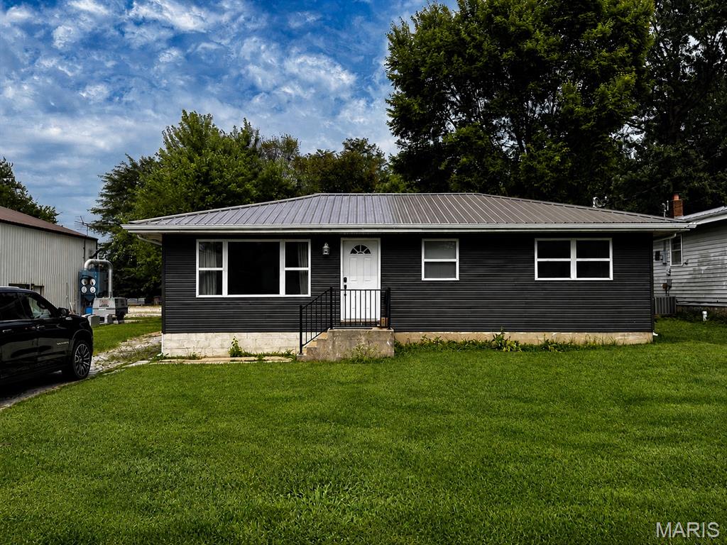 Welcome home to 445 Manion St, a beautifully renovated 4-bedroom, 2-bathroom ranch in the heart of Sullivan!

Boasting 1,310 square feet this home has been newly updated to offer a fresh and modern feel. Step inside to discover a bright, inviting layout complete with charming details like space-saving pocket doors and crisp, contemporary finishes throughout. With all four bedrooms and two full bathrooms conveniently located on the main level, this floor plan is thoughtfully designed for effortless daily living.

The home is well-equipped with modern comforts, including central air and electric forced-air heating, to keep you comfortable year-round. Situated on a fantastic level lot, the property offers a low-maintenance exterior with a great yard for outdoor enjoyment. You'll also love the convenient location, situated within the Sullivan School District and just a short distance from local town amenities.

With its brand-new look and true move-in-ready appeal, this home won't last long. Schedule your showing today and make this completely revitalized house your new home! Home is Agent Owned!