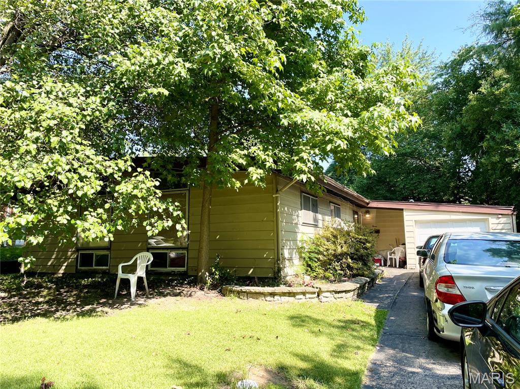 Comp purposes only. 3 bed / 2 full bath plus a bonus room. 1242 sqft slab with attached garage, level lot, and shed.