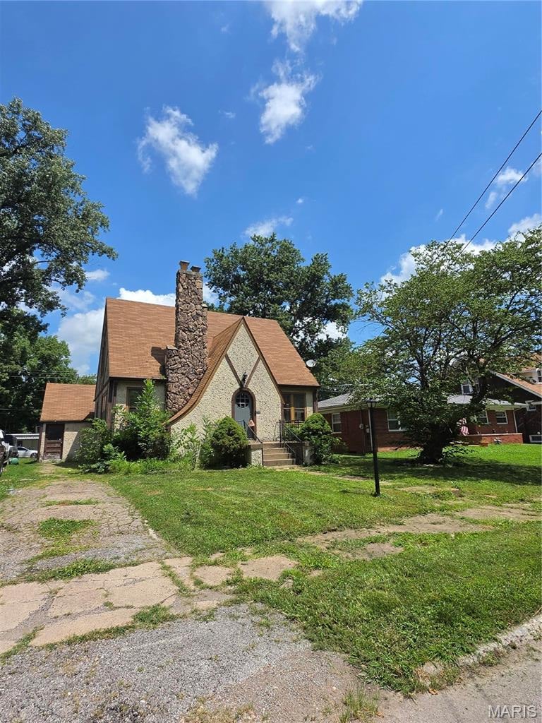Excellent curb appeal on this beautiful home. This 3 bedroom 1.5 bathroom home is ready for a new family to enjoy! This Unique home features Wood Floors, Fireplace, Living Room, Large Bedrooms with great closet space, 2 Baths, Dining Room, Family Room, Laundry Room and Outside Shed, Basement is partially finished. Conveniently located close to Shopping, Transportation, Lindenwood University and more. sold as-is. The agent has an interest in the property being sold