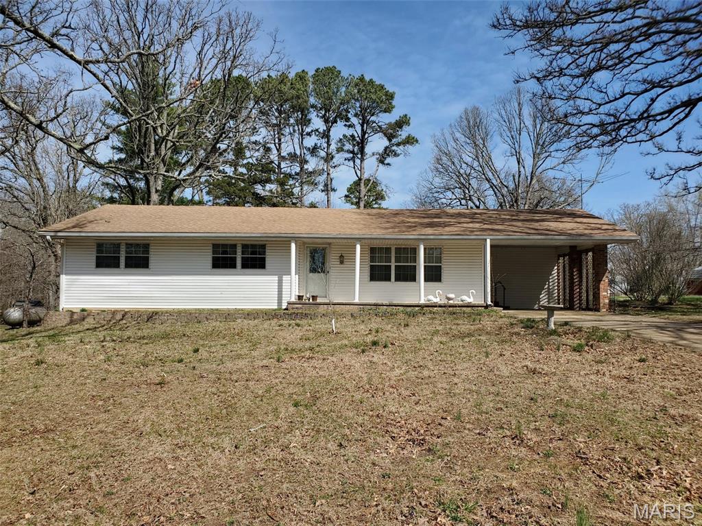 Check out this charming 3 bedroom, 2 bath ranch nestled in the heart of Houston! Built in 1967, this home exudes timeless appeal. Spacious family room leading to the kitchen featuring wood cabinets, ample storage and plenty of counterspace. Adjacent to the dining area is a sunroom, perfect for entertaining or relaxation. Nice laundry room offers more options for storage with built in cabinets, sink and storage closet. Master bedroom with adjoining master bath. Large backyard with patio, landscaping and storage shed. Covered front porch and carport. Located on a .35 acre lot in a quiet neighborhood. Conveniently located close to local amenities.