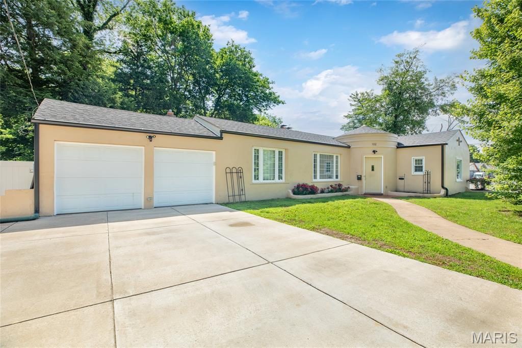 Welcome to 102 Mesa in Collinsville! This one-of-a-kind Tuscan-inspired home offers timeless character, distinctive architecture, and over 2,300 square feet of living space. Featuring 3 bedrooms, 2 bathrooms, and a 2-car attached garage, this home is packed with charm and thoughtful updates throughout.  The spacious living room showcases soaring vaulted ceilings and a cozy fireplace, creating the perfect gathering space. Recent improvements provide peace of mind, including a newer HVAC system and water heaters. In 2026, the sellers completed several major upgrades, including a new roof, painted the exterior of the home, gutters, luxury vinyl flooring, and patio doors. Additional improvements include a concrete driveway installed in 2021.  Situated on a large corner lot, the property also features a fenced backyard ideal for entertaining, pets, or simply enjoying your outdoor space. If you're searching for a home with personality, warmth, and architectural character that stands apart from the ordinary, this is a must-see opportunity!