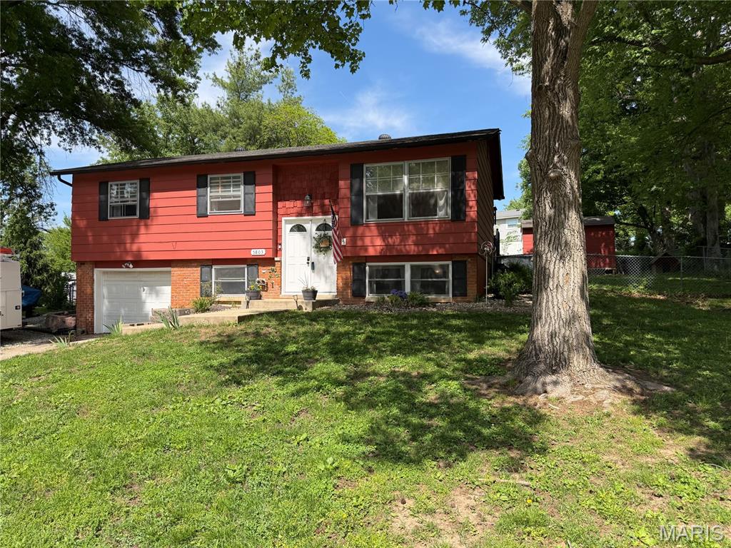 Charming split-level home in Piasa Hills neighborhood features 4 bedrooms and 2 baths. The updated kitchen offers newer appliances, ceramic tile floors, and newer lower cabinets.  The living room offers beautiful hardwood floors that extend to the dining room and throughout the main level adding warmth and charm. Downstairs you'll find a spacious family room along with a 4th bedroom. Step outside to enjoy the above-ground pool with a new liner and fenced in yard, perfect for relaxing or entertaining complete with a single car garage for added convenience. This home blends comfort, style, and a great location.  Perfect for entertaining inside and out! ***Please see list of updates under disclosures.*** Exclusions:  Rose bush at the front corner of the driveway, small lavender bush on left side of house, and small hydrangea at the right front corner of the property.