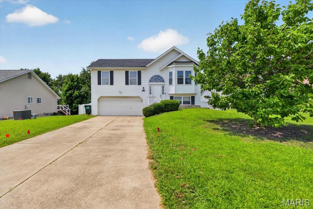 Rare 4-Bedroom, 3-Bath Cul-De-Sac Gem in St. Charles!

Welcome home to 991 Sunset Farms Court! Tucked away on a quiet, low-traffic cul-de-sac in the highly desirable Sunset Farms subdivision, this beautifully updated split-foyer home offers incredible space, comfort, and convenience.

Step upstairs into the bright, open main living area, where vaulted ceilings create an incredibly airy and welcoming feel. The kitchen flows effortlessly into the dining area, making meal prep and daily living a breeze. The main level hosts three comfortable bedrooms, including a primary suite with its own private bathroom, plus a second full hall bath.

The fully finished lower level is a true standout, offering a spacious second family room/rec area, or a generous 4th bedroom, and a 3rd full bathroom—making it the ultimate setup for guests, a teenager's retreat, or a private home office.

Step outside to enjoy a great backyard perfect for entertaining, pets, or play. Best of all, you are located in the premier, award-winning Francis Howell School District and sit just minutes from the vibrant shopping, local dining, and parks of nearby Cottleville.
Key Features:
4 Bedrooms / 3 Full Baths (Hard-to-find layout!)
Quiet Cul-De-Sac Lot in Sunset Farms
Fully Finished Lower Level with Family Room or 4th Bed, & 3rd Full Bath
Oversized 2-Car Attached Garage
Highly Rated Francis Howell Schools