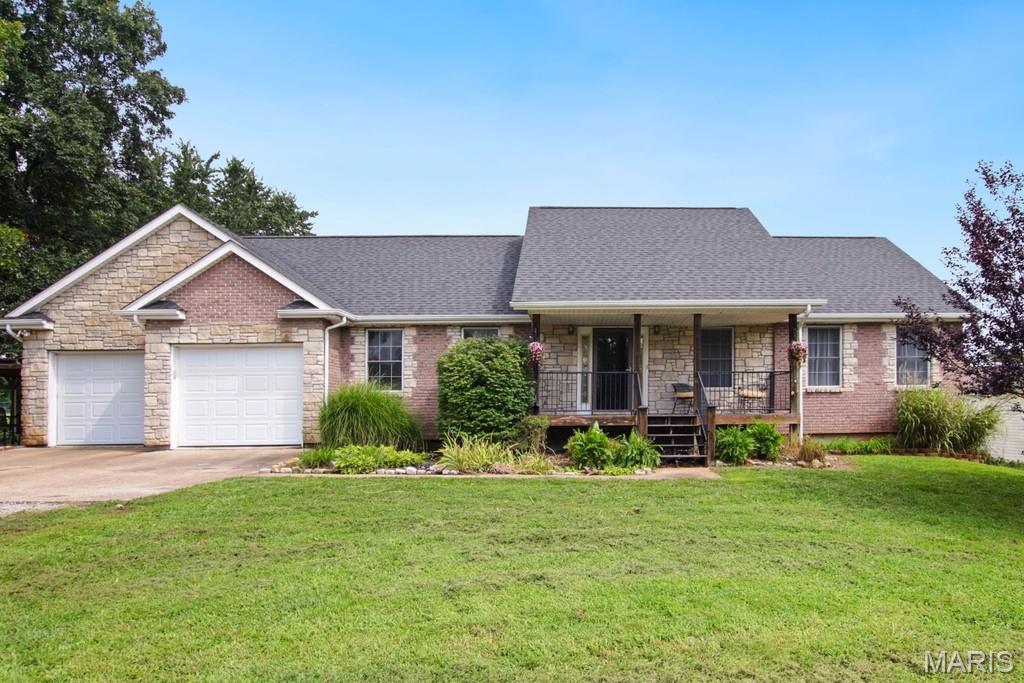 Welcome home! This beautiful ranch offers the space, comfort, and warmth you’ve been looking for, with 3 bedrooms, 1 nonconforming bedroom, and 3 full bathrooms, all nestled on a spacious .678 of an acre at the end of a dead end street. From the moment you step into the welcoming foyer, you’ll immediately notice the inviting open layout and beautiful natural light coming through.  The vaulted living room flows effortlessly into the dining area and kitchen, creating a comfortable gathering space for everyday life, family dinners, and entertaining friends. The kitchen features concrete countertops, and the dining area opens right onto the deck, making it easy to take the fun outside and enjoy the backyard. The main level offers a convenient laundry room and generously sized bedrooms, each with its own walk-in closet. The spacious primary suite is a wonderful place to unwind at the end of the day, featuring a private bathroom with a separate shower, relaxing jetted tub, and an exceptionally large walk-in closet. Downstairs, the fully finished walkout basement gives you even more room to live and enjoy. The recreation area is perfect for movie nights, game days, or simply gathering with family, while the additional sleeping room offers plenty of flexibility for guests, an office, home gym, playroom, or whatever fits your lifestyle. A separate storage room provides even more space to keep everything organized. Outside, you’ll find plenty of room to enjoy the peaceful setting. Relax on the deck, gather around the patio and pergola, or simply let the kids, pets, and family enjoy the large yard. There’s room here to make memories and truly enjoy your time at home. And if you need even more space, the 32’ x 30’ detached two-car garage is ready for vehicles, hobbies, projects, storage, or a workshop. Additionally, this home includes a newer roof, brand new carpet on the main level, and all appliances staying with the home, including the washer and dryer. With its comfortable layout, beautiful natural light, generous storage, finished walkout basement, spacious yard, detached garage, and peaceful location, this is a home that truly offers room to live, relax, gather, and grow. Come take a look and see if this could be the place you’ve been waiting to call home!
