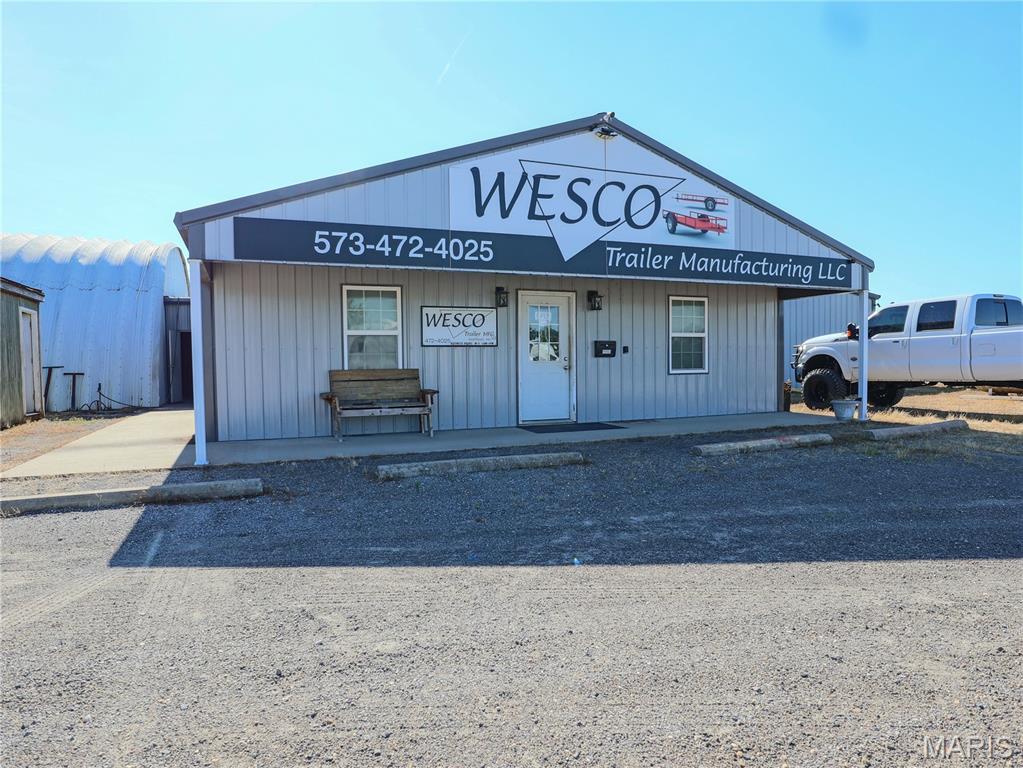 Prime highly-visible commercial/industrial property located just off Exit 58 and Interstate 55, offering exceptional access and outstanding exposure for a wide range of business uses.  Situated on 2.93 acres, the site is well-positioned for industrial, manufacturing, or warehousing operations. Also located about a mile from three major truck stops: Love's Travel Stop, Flying J Travel Center, and TA Travel Center making it a hub for commercial trucking. 

A 792 SF office building designed for administrative functions, customer reception, and staff workspace, along with approximately 16,218 SF of warehouse/manufacturing space featuring high ceilings ranging from 14' to 17' and seven overhead doors ranging from 16' to 20' wide and 10' to 14' tall to support efficient operations. Located in the Quonset is a professional grade paint booth that measures 16' wide by 50' long. This site is equipped with 3-Phase power. 

Additional improvements include two detached outbuildings—one equipped with an overhead door and previously utilized as a steel-cutting shop, and another serving as a dedicated breakroom. A detached carport is located at the rear of the property, providing additional covered utility space. Several pieces of equipment are included in the sale, with a detailed inventory available upon request.

With its strategic interstate location, flexible layout, and existing infrastructure, this property offers a turnkey opportunity for an expanding manufacturing or industrial user, or an investor seeking a highly visible, adaptable commercial asset.