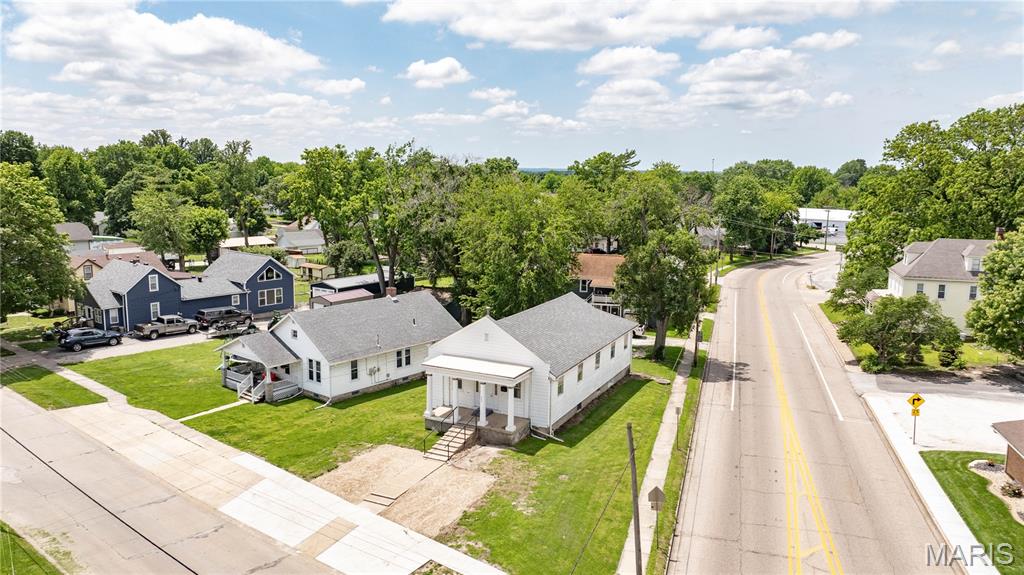 This spacious residential property offers an abundance of flexible living space and is situated on a convenient corner lot location. Featuring multiple large gathering areas, bonus rooms, office spaces, and storage areas throughout, this property provides endless possibilities for a growing family, home-based business, hobby space, or multi-purpose living arrangement.

The main level features a large 46’ x 27’ living and gathering area complete with a 15’ x 8’ raised stage area that could serve as an entertainment space, recreation area, or be customized to fit your needs. Additional main-floor features include multiple office/storage rooms, a half bath, and access to the lower level from a rear staircase.

The lower level offers even more usable space with a large family or recreation room, kitchen area, office, bonus room, half bath, and an oversized storage room. Central air and aluminum siding add to the property’s comfort and low-maintenance appeal.

Whether you’re looking for a unique residentially zoned property with room to spread out, space for entertaining, or a property with endless customization potential, this corner-lot home offers a rare opportunity with exceptional versatility and new off road parking.