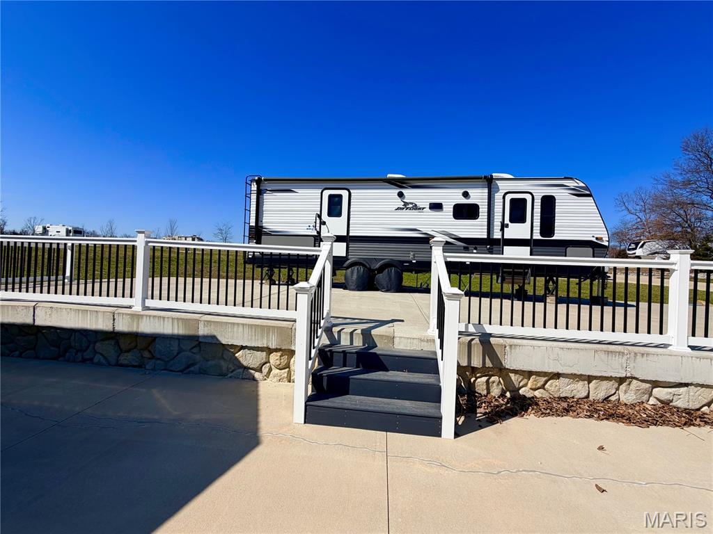 AMAZING CAMPING RETREAT AT MARK TWAIN LAKE!! Check out this Beautiful RV lot in Adventure Out RV Park! Bring your RV and enjoy this peaceful lot close to all the amenities at the lake. Jellystone Park, the Cannon Dam, Blackjack Maria and Spaulding Beach are all just minutes from the RV park. Lot 85 is 0.115/acre and has TWO large concrete pads measuring approximately, 80' x 22' each, perfect for your camper and multiple vehicles.  This lot has vinyl fencing dividing the two concrete pads and a large patio area for family gatherings!  The park is very clean and well maintained! Private fishing pond available to all lot owners!  Why lease, when you could own your own lot! Call today to make this your new getaway at the lake! What are the costs for your lake getaway? HOA is $200/year for 2026. RV park bills for Electric, Trash and Sewer. You pay your own water and internet. Take the main entry road into Adventure Out RV Park (Look for directional sign). Once you enter the park, turn on the first drive to the left, then take the first right . Lot 85 will be the last lot on the right.  Shed is NOT included with this sale, but can be purchased separately.    Call today for your private showing.
