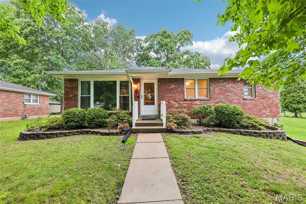 Welcome home to this beautifully updated all-brick ranch offering the perfect blend of timeless charm, functional living space, and major mechanical updates in one of the Metro East’s most convenient locations. From the moment you arrive, the curb appeal stands out with classic brick construction, newer vinyl windows, maintenance-free gutter guards, and a BRAND NEW ROOF installed in April 2026 — giving buyers peace of mind for years to come.

Step inside and immediately notice the fresh luxury vinyl plank flooring flowing throughout the main level, paired perfectly with classic 6-panel doors and warm natural light. The spacious living areas offer the ideal mix of comfort and functionality, while the updated kitchen is designed to impress with abundant counter space, granite countertops, tiled backsplash, pantry storage, and a large breakfast bar/peninsula perfect for entertaining, meal prep, or casual dining. The corner sink adds to the thoughtful layout, while the gas range is a major bonus for buyers who love to cook.

The bathroom features a beautifully tiled shower surround that elevates the space with a clean, updated feel. Downstairs, the walkout basement provides excellent additional storage, laundry space, and future finishing potential. Washer and dryer stay with the home, while the gas water heater and gas furnace help provide efficient utility performance.

Out back is where this home truly shines. The fenced backyard is shaded by mature trees and centered around a massive patio area that is absolutely perfect for summer evenings, grilling, entertaining guests, or simply relaxing outdoors. A storage shed adds even more functionality for tools, lawn equipment, or hobbies.

If you’ve been searching for a move-in ready brick home with modern updates, a functional floor plan, incredible outdoor space, and major value already built in, this is the one. Conveniently located near shopping, dining, schools, parks, SAFB, and interstate access, this home combines charm, updates, and location into one incredible opportunity.