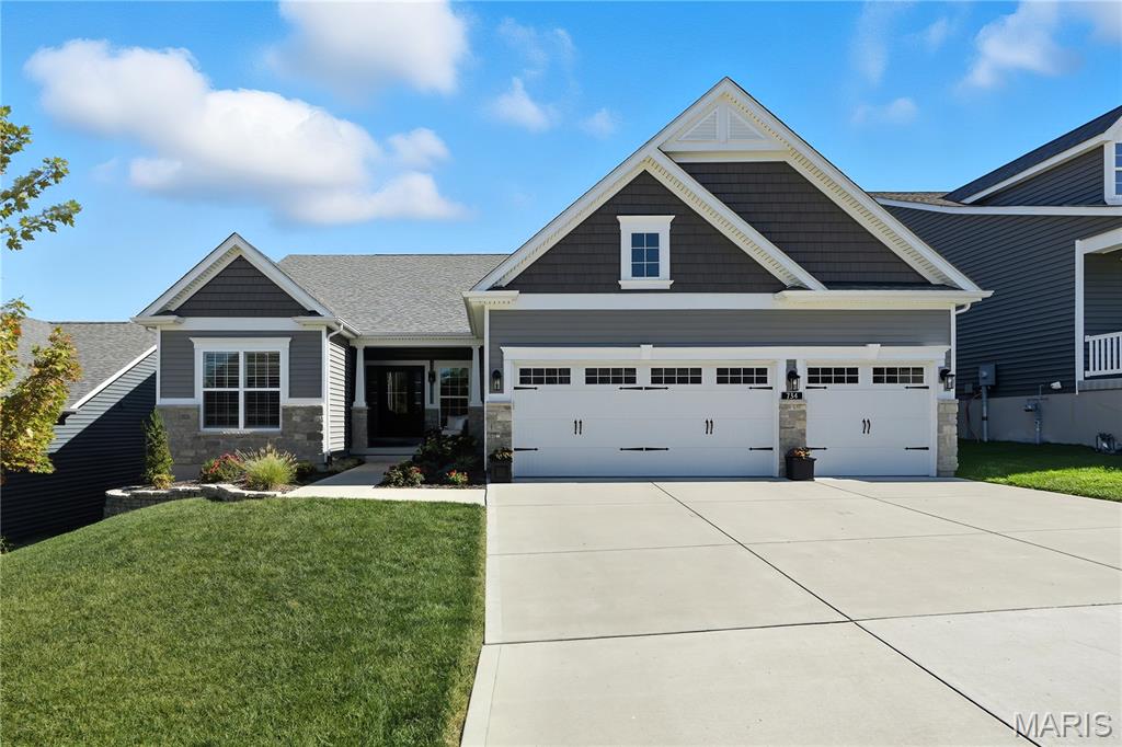 WHY BUILD when you can move into this STUNNING 5 YEAR NEW RANCH built by CONSORT HOMES!  On a gorgeous premium lot  backing to wooded common ground with magnificent views of the hills of Eureka.  You'll love the sprawling open floor plan, high-end architectural upgrades, and abundant windows that bathe every room with natural light. Striking curb appeal, welcoming front porch. Step inside to find thoughtful design and elegant finishes throughout. Rich hardwood floors flow seamlessly throughout the main living areas. An impressive formal dining room creates the perfect backdrop for memorable gatherings. A spacious private office with glass french doors offers both style and function. The expansive family room features a cozy gas fireplace and a dramatic wall of windows overlooking the tranquil backyard. The gourmet kitchen is a true showpiece, with abundant custom cabinetry, quartz countertops, a gas cooktop, wall oven & microwave, large center island with breakfast bar seating and more. The spacious breakfast room has a bay window, and an atrium door that opens to a generous composite deck—ideal for relaxing or entertaining while enjoying peaceful wooded views. Additional highlights include an elegant powder room and a spacious main floor laundry room for added convenience. The owner’s suite is a private retreat, complete with a bay window sitting area, spa-inspired bath, and an oversized walk-in closet. Two additional spacious bedrooms and a beautifully appointed hall bath complete the main floor. Sprawling lower level provides opportunity for additional living space if desired.   With Consort Homes Pierce floor plan, this exceptional home blends modern comfort with timeless design. Don’t miss this extraordinary opportunity!