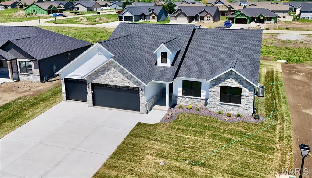 Penn Builders' New Construction, located minutes from Interstate Hwy access on @1/4 acre lot. Preliminary Specs/Subject to Changes. 4 Bed/3.5; Bath; Split BR/Open Floor Plan; Featuring 9' foundation with raised LR ceiling & vaulted Primary BR ceiling; Craftsman style Front Door; Farmhouse style interior trim; Vinyl Siding with partial Stone front; Covered Front Porch with overhead light & Covered Patio with ceiling fan/light. ZIP system sheeting on exterior framed walls; house insulation R-13 walls/R45 blown fiberglass in ceiling; Certainteed Landmark architectural shingles; Quaker Manchester low-e, tilt-wash, single-hung windows with screens; upgraded RigidCore LVP flooring in LR, Kitchen, Dining, Entry Foyer; Laundry; Walk-In Pantry; Garage Entry; Hall; Full Hall Bath & Half Bath. Tile flooring in Primary & Basement Baths. Carpet in BRs & FR. Kitchen includes: Quartz countertops/tiled backsplash; stainless steel appliances~~5-burner gas range/oven, range hood; dishwasher & microwave; and large island with counter seating. Homecrest Arbor cabs in Kitchen & Baths with soft close dovetail drawers; Upgraded Delta faucets with Lever Handles in Kitchen & Baths. Cultured marble countertops in Baths. Double sinks; comfort height countertop; linen cabinet; walk-in closet; water closet with pocket door; tile floor; window; large tiled shower with showerhead + rain can; and premium shower door with towel bar in Primary Bath. Window & linen cabinet in Full Hall Bath.  Elongated Electric Fireplace (color changing with thermostat, blower, electronic control panel & remote) in LR with Mantle & Tiled Face to Ceiling.  Basement includes a FR; BR with egress & walk-in closet; Full Bath; and a spacious, unfinished storage room with an HVAC vent. Drop Zone inside garage entry. Main floor Laundry includes window; electrical outlets; water hookups & dryer vent. Finished/insulated (R11 walls/R19 ceiling) 3-Car Garage with belt driven Wifi openers, keypad & water spigot + 2 exterior water spigots. Hi-Eff HVAC; 50-gal commercial grade water heater; plumbed for water softener.  Sodded yard with buried downspouts and front landscaping.  200 amp electric; Southwestern Electric for electricity/Ameren for natural gas.  More photos coming soon. 1 year builder warranty. C&Rs avail at: https://www.rlpdevelopment.com/subdivision/homes-of-liberty-place