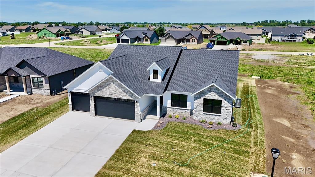 Penn Builders' New Construction, located minutes from Interstate Hwy access on @1/4 acre lot. Preliminary Specs/Subject to Changes. 4 Bed/3.5; Bath; Split BR/Open Floor Plan; Featuring 9' foundation with raised LR ceiling & vaulted Primary BR ceiling; Craftsman style Front Door; Farmhouse style interior trim; Vinyl Siding with partial Stone front; Covered Front Porch with overhead light & Covered Patio with ceiling fan/light. ZIP system sheeting on exterior framed walls; house insulation R-13 walls/R45 blown fiberglass in ceiling; Certainteed Landmark architectural shingles; Quaker Manchester low-e, tilt-wash, single-hung windows with screens; upgraded RigidCore LVP flooring in LR, Kitchen, Dining, Entry Foyer; Laundry; Walk-In Pantry; Garage Entry; Hall; Full Hall Bath & Half Bath. Tile flooring in Primary & Basement Baths. Carpet in BRs & FR. Kitchen includes: Quartz countertops/tiled backsplash; stainless steel appliances~~5-burner gas range/oven, range hood; dishwasher & microwave; and large island with counter seating. Homecrest Arbor cabs in Kitchen & Baths with soft close dovetail drawers; Upgraded Delta faucets with Lever Handles in Kitchen & Baths. Cultured marble countertops in Baths. Double sinks; comfort height countertop; linen cabinet; walk-in closet; water closet with pocket door; tile floor; window; large tiled shower with showerhead + rain can; and premium shower door with towel bar in Primary Bath. Window & linen cabinet in Full Hall Bath.  Elongated Electric Fireplace (color changing with thermostat, blower, electronic control panel & remote) in LR with Mantle & Tiled Face to Ceiling.  Basement includes a FR; BR with egress & walk-in closet; Full Bath; and a spacious, unfinished storage room with an HVAC vent. Drop Zone inside garage entry. Main floor Laundry includes window; electrical outlets; water hookups & dryer vent. Finished/insulated (R11 walls/R19 ceiling) 3-Car Garage with belt driven Wifi openers, keypad & water spigot + 2 exterior water spigots. Hi-Eff HVAC; 50-gal commercial grade water heater; plumbed for water softener.  Sodded yard with buried downspouts and front landscaping.  200 amp electric; Southwestern Electric for electricity/Ameren for natural gas.  More photos coming soon. 1 year builder warranty. C&Rs avail at: https://www.rlpdevelopment.com/subdivision/homes-of-liberty-place