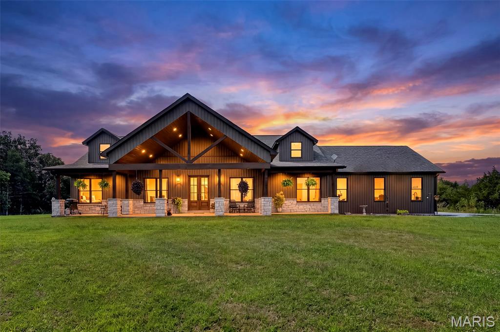 Stunning 5 year old Custom Home on 20 acres just north of Silex. Tucked just off of blacktop State HWY UU, this beautiful home offers 3 bedrooms and 2.5 baths, vaulted ceilings, open floor plan and custom finishes throughout.  The unfinished walk out lower level  provides the opportunity to add more finished living space and customize to your liking. The inviting covered back patio overlooks a private lake while the large covered front porch looks over another shared lake.  Whether you love to fish or just want to feel like you are surrounded by water, this property offers unparalleled privacy, views and recreation. Call to schedule your private showing today.