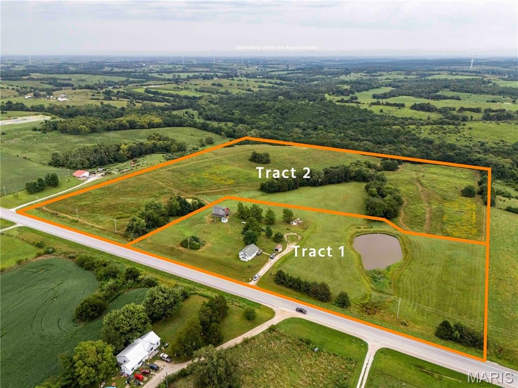AUCTION LISTING - List price is not indicative of Seller’s final reserve amount.  This property is part of an online bidding event.  This sale will be executed with a no-contingency contract provided by brokerage representing the Seller. See MLS Supplement Document for complete details. 

Located along U.S. Highway 63, approximately 20 miles north of Kirksville, Missouri, this 34.7-acre property will be offered at public auction in two individual tracts. With blacktop frontage, natural gas and electricity available on-site, quality improvements, income-producing CRP acreage, and excellent hunting opportunities, this property offers something for homeowners, hunters, farmers, and investors alike.

Whether you’re looking for a country home, recreational retreat, or productive acreage with annual income, this Northeast Missouri property deserves your attention.

Tract 1: 7.1 Acres | Country Home, Stocked Pond & Barn

Tract 1 features a well-maintained 2-bedroom, 1-bath home situated on approximately 7.1 acres. The home is served by electricity, natural gas, and a lagoon sewer system, providing the comforts of country living with modern utilities. A stocked pond and barn complement the property, making it an ideal rural homesite with room to enjoy the outdoors.

With excellent frontage on U.S. Highway 63 and a convenient location just minutes from Kirksville, this tract offers the perfect combination of accessibility and peaceful country living.

Tract 2: 27.6 Acres | Recreation, Income & Agricultural Potential

Tract 2 consists of approximately 27.6 acres featuring a diverse blend of pasture, CRP acreage, and wooded draws that create outstanding wildlife habitat. The property is home to healthy populations of whitetail deer and wild turkey, making it an excellent recreational tract for hunting enthusiasts.

There is ample opportunity to further improve the property by establishing additional food plots and wildlife cover while still maintaining its agricultural value. Good fencing is already in place along the north and south property boundaries, and a small cattle watering pond provides an excellent water source for livestock or wildlife.

Whether you’re looking to expand a cattle operation, establish a hobby farm, improve wildlife habitat, or simply enjoy a recreational getaway, this tract offers exceptional versatility.

Conservation Reserve Program (CRP)

A significant portion of Tract 2 is enrolled in the Conservation Reserve Program (CRP), providing dependable annual income while enhancing wildlife habitat and protecting the land’s natural resources.

The property currently has 19.87 acres enrolled in CRP, generating an annual payment of $2,621, with the current contract extending through September 30, 2031. This income-producing feature provides an immediate return while allowing the future owner to enjoy the recreational and conservation benefits of the property.