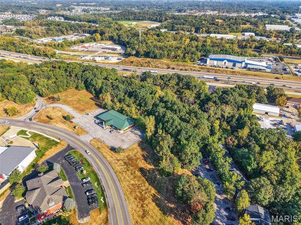 8.19 Highly visible commercial acres between Lake Saint Louis Blvd and the South Service Road of I-70 (Veterans Memorial Parkway) in an ideal location! An additional 5.82 acres of commercial ground is available immediately adjacent to and across the street, for a total of 14.01 acres!  Commercial ground along the I-70 corridor, in LSL and close to an overpass is becoming increasingly rare... don't miss out on this opportunity to showcase your business plan in a highly visible and sought-after area! All City utilities are available! Planned unit developments with a strong commercial component are encouraged! Schedule your appointment today! Additional 5.82 acres available, see Listing #25063537.
