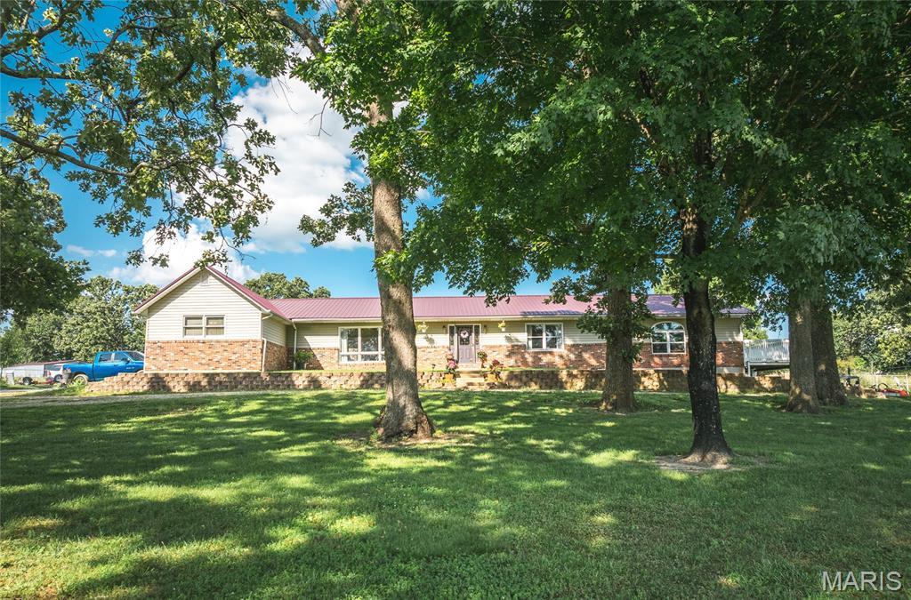 Spacious and versatile 6-bedroom, 3-bath home on 7.86 fenced acres in the growing community of St. James! Ideally located with Hwy 68 frontage just minutes from local wineries, restaurants, shopping, the new Amazon site, Walmart distribution center, and the beautiful Meramec River. This unique property offers endless possibilities including a private residence, bed & breakfast, senior living facility, or AirBnB investment opportunity.

The home features a custom cabinet kitchen opening into a massive Florida room with balcony access, creating the perfect space for entertaining. Handicap accessibility is found throughout the property with ramp entrances across the back of the home. The finished basement includes 3 bedrooms, 1 bath, a spacious family room, and access through either the interior staircase or oversized 2-car garage complete with built-in shelving and workbench. Upstairs laundry adds convenience to the functional layout.

Outdoor amenities are equally impressive with white pipe fenced horse pastures, subdivision potential with additional road frontage, a flourishing herb garden, above-ground pool, stunning stone patio with gazebo, and a barn equipped with water, electric, and wash station. The custom chicken coop also features full concrete flooring along with water and electric. A rare opportunity to own an income-producing or multi-use property with acreage in one of Missouri’s fastest growing areas!