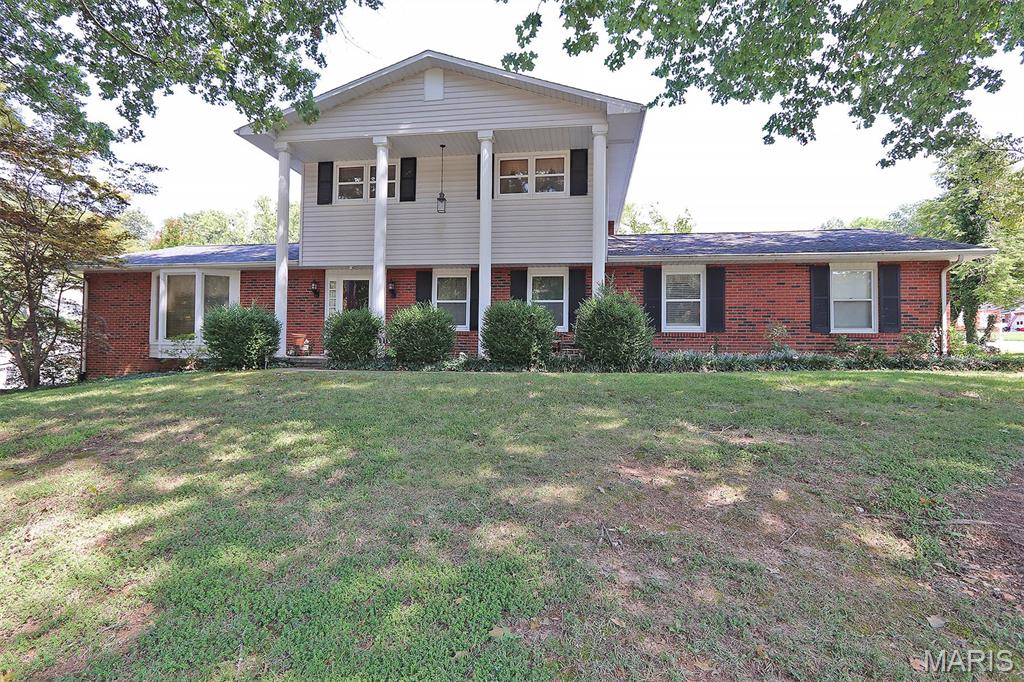 Outstanding brick with large columns on corner lot with 4 bedrooms, 3.5 bathrooms, large mature trees, beautiful 20x40 inground pool with fenced backyard with wrought iron fencing.  Must See!!!