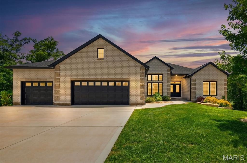 Welcome to this exceptional ranch home nestled in a quiet cul-de-sac in Wentzville, offering the perfect combination of space, luxury, and privacy. This beautifully maintained residence features 4 bedrooms and 3 full bathrooms on the main level, designed for comfortable everyday living and effortless entertaining. The heart of the home is a custom kitchen showcasing high-end cabinetry, premium finishes, abundant counter space, and an open layout that flows seamlessly into the main living and dining areas. The spacious primary suite offers a private retreat , while the additional bedrooms provide flexibility for family, guests, or home office needs. Car enthusiasts and hobbyists will appreciate the oversized 3-car attached garage on the main level, plus an additional attached garage accessible from the finished lower level, providing exceptional storage and workspace options. The professionally finished walkout basement expands the living space significantly and includes a large recreation area, an additional bedroom, and a full bathroom perfect for guests, multigenerational living, or entertaining. Step outside to enjoy a private backyard oasis backing to mature trees, offering peaceful views and added privacy rarely found. Situated in a desirable cul-de-sac location, this home combines tranquility with convenient access to Wentzville's shopping, dining, parks, and top-rated schools.

Don't miss this rare opportunity to own a spacious ranch home with premium features, extensive garage space, a finished lower level, and a private wooded setting.