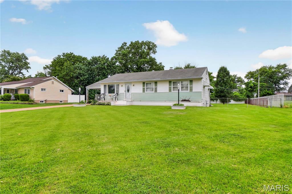 Welcome to this charming 3-bedroom, 1-bath ranch home situated on a spacious half-acre lot in the highly sought-after Lindbergh School District. Offering over 1,000 square feet of main-level living, this home features a functional floor plan with a bright living room, dining area, and a full basement providing endless possibilities for storage, recreation, or future finishing. Enjoy the large, level backyard with plenty of space for outdoor entertaining, gardening, or play. Additional features include central air, forced-air gas heat, public utilities, vinyl siding, and a covered carport. Conveniently located near schools, shopping, parks, and major highways, this property presents an excellent opportunity for homeowners, investors, or anyone looking to make a home their own. Don't miss your chance to own this wonderful property!