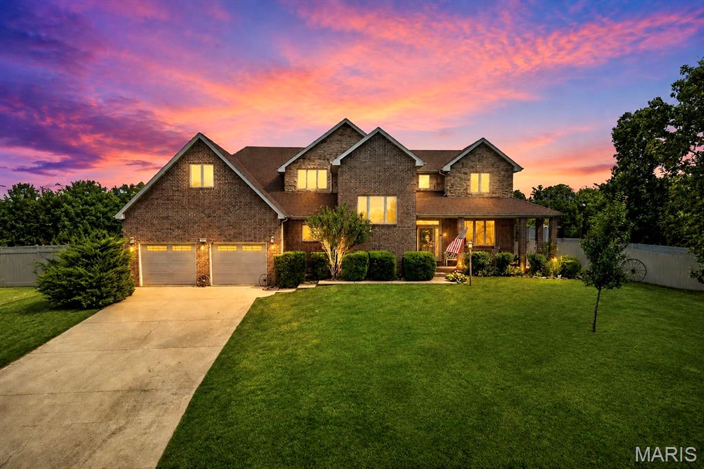 Nestled on a beautifully landscaped .82-acre lot within city limits, this meticulously maintained all-brick residence offers an exceptional combination of timeless craftsmanship, modern upgrades, and expansive outdoor living. Featuring 4 spacious bedrooms, 2.5 bathrooms, and a dedicated home office or formal dining room, this remarkable property is thoughtfully designed for both everyday comfort and effortless entertaining. Step inside to discover an inviting open-concept floor plan enhanced by 9-foot ceilings, abundant natural light, and professional solar-treated Andersen windows throughout. The beautifully remodeled kitchen serves as the heart of the home, showcasing granite countertops, custom cabinetry, a generous walk-in pantry, and seamless flow into the dining and living areas. The stunning living room is highlighted by vaulted ceilings and a cozy gas fireplace, creating a warm and welcoming gathering space. The private main-level primary suite offers convenience and comfort, while three additional bedrooms provide ample accommodations for family and guests. Rich wood flooring, an elegant custom-built open staircase, and thoughtfully placed carpeting add warmth and sophistication throughout the home.
Outdoor living is equally impressive, featuring a charming covered wrap-around porch, open patio, and a fully privacy-fenced backyard designed for relaxation and recreation. Large double gates provide easy access to a newly poured 6-inch reinforced concrete RV driveway, complete with a dedicated parking pad, 30-amp electrical pedestal, and additional storage shed. A multi-zone in-ground sprinkler system services both the front and rear yards, maintaining the property’s exceptional curb appeal year-round. The oversized two-car garage is a standout feature, offering insulated garage doors, 12-foot ceilings, an additional insulated service door, and an EF5-rated tornado shelter for ultimate peace of mind. Combining classic curb appeal, thoughtful upgrades, outstanding functionality, and an unparalleled amount of outdoor space, this extraordinary property presents a rare opportunity to own a truly one-of-a-kind home that delivers privacy, convenience, and lasting value. Schedule your private showing today.
