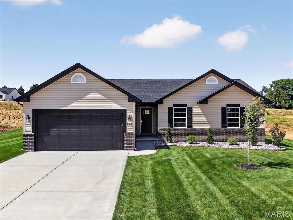 Huge savings, MOVE IN READY!  New Construction by Steve Thomas Custom Homes in Westwood Farms, a new homes community in a fantastic Warrenton location!  Featuring quality construction, desirable finishes and a smart, open, floor design, this home is ready for you.  The low maintenance exterior offers fantastic curb appeal with partial brick, vinyl siding, 30 year Tamko Titan XL 30 year architectural shingles, upgraded .44 mil siding, added width driveway, garage coach lights, full yard sod and landscaping.  The floor plan is open and spacious with vaulted ceilings and offers maximum privacy with the Primary Bedroom and the secondary bedrooms on opposite sides of the home. Features include 3 bedrooms, 2 bathrooms, vaulted ceilings in the Great Room-Kitchen-Breakfast Room-Foyer, luxury vinyl plank flooring in the main living areas, 42 inch cabinets, quartz countertops, island with seating bar, walk in pantry, GE appliances, open stairs to the lower level, main floor laundry, walk in closet in the Primary Bedroom, raised height double bowl vanity in the Primary Bath, shower with semi frameless shower doors, linen closet, transom window in the Primary Bath for added natural light, low E windows, 50 gallon electric water heater, electric HVAC, Tyvek house wrap, closed cell foam spray insulation at the subfloor, termite pretreatment, Watch Dog exterior foundation waterproofing, 2 exterior hose bibs plus one in the garage, garage door opener, patio and more.  The lower level has an egress window, rough in bath, sump pit and pump for an easy future finish if desired.  This conveniently located neighborhood has easy access to Highways 70 and 47, restaurants, shopping, services, recreation and more.  Westwood Farms is a tree-lined neighborhood with gentle, rolling terrain and generous spacing between the homes.  Enjoy quality construction by Steve Thomas Custom Homes, a member of the St. Louis Homebuilders Association with 35+ years of experience in the home building industry.  Fantastic opportunity, check it out!