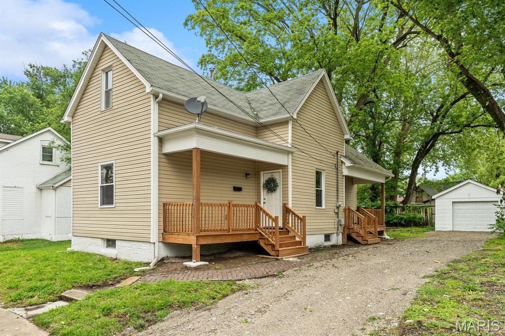 Welcome to 212 N 12th St. in Belleville, Il. This completely remodeled 4-bedroom, 2-bathroom home offers the perfect blend of character and modern updates! Step inside and you'll find spacious rooms, tall ceilings, and a bright open feel throughout. This home has been thoughtfully updated while still maintaining its charm. All bedrooms feature brand new carpet, while luxury vinyl plank flows throughout the rest of the home adding both style and durability. The eat-in kitchen has been beautifully updated with new cabinets and stainless appliances. New lighting and ceiling fans throughout the home, add modern touches and comfort.  2 bedrooms and a full bath complete the main level.  Upstairs you will find 2 more large bedrooms (one with a large 5x13 walk-in closet), a loft area, and another full bathroom completing the second level. Outside there are 2 TWO covered porches and a 1 car detached garage. Conveniently located and packed with updates, this home is a must see for anyone looking for space, style and value! Full unfinished basement.  Agent interest