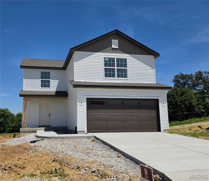 Beautiful new construction home for sale in Wright City, MO! Located at 507 Mountain Drive in the Alder Creek community, this move-in ready "Sycamore" floorplan by Houston Homes, LLC offers 3 bedrooms, 2.5 bathrooms, a 2-car garage, and 1,600 sq. ft. of open-concept living space. Unmatched curb appeal welcomes you with white Dutchlap siding, upgraded Smoky Ash vertical accents, a dark brown garage door with windows, Pella colonial-style windows, and a Therma-Tru front door highlighted by matte black coach lights. Inside, the light-filled main floor features extra windows in the great room and kitchen, premium laminate flooring, and matte black plumbing fixtures. The gourmet kitchen boasts a center island, granite countertops, 39" premium crowned wood cabinets with soft-close doors/drawers, and stainless GE appliances. Upstairs, find a convenient second-floor laundry room and a spacious owner's suite with a private bath featuring a bypass shower door and 1-ft seat. The 8' walkout basement includes a sliding glass door, window, and 3/4 rough-in for future finish. Enjoy a 10-year foundation leak warranty, 1-year builder warranty, concrete driveway, 50-gal water heater, and energy-efficient blown-in insulation. Don’t miss this new build home in Wright City R-II School District—schedule your tour today!