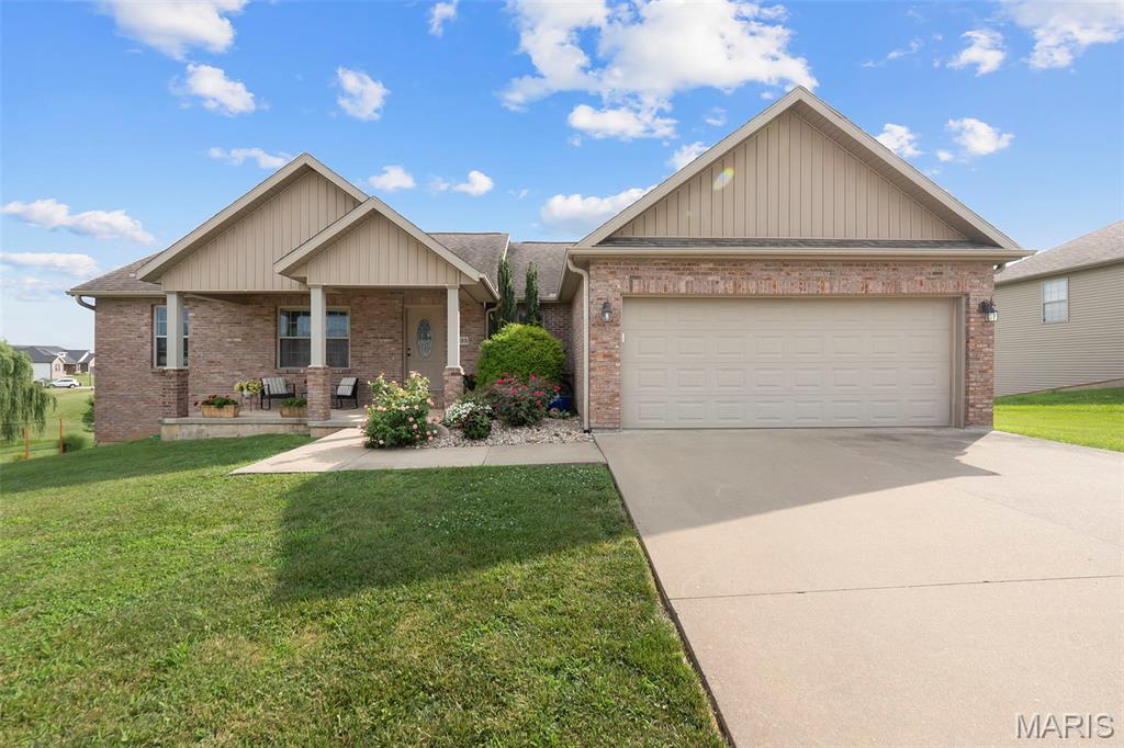 Beautifully maintained 4-bedroom, 3-bathroom home offering 2,486 square feet of thoughtfully designed living space. The main level features vaulted ceilings, a desirable split-bedroom floor plan, and a spacious kitchen with granite countertops, stainless steel appliances, and ample cabinet space. Main-level laundry adds everyday convenience. The primary suite includes a large Jacuzzi tub, creating a relaxing retreat. Step onto the spacious back deck and enjoy beautiful views overlooking the fully fenced backyard, perfect for children, pets, gardening, or entertaining. The finished walkout basement offers a large family room, oversized bedroom, full bathroom, generous storage, and a John Deere room for lawn equipment, tools, or hobbies. Combining quality finishes, functional space, and inviting indoor and outdoor living, this home is ready for its next owner. Don't miss your opportunity to make it yours!
