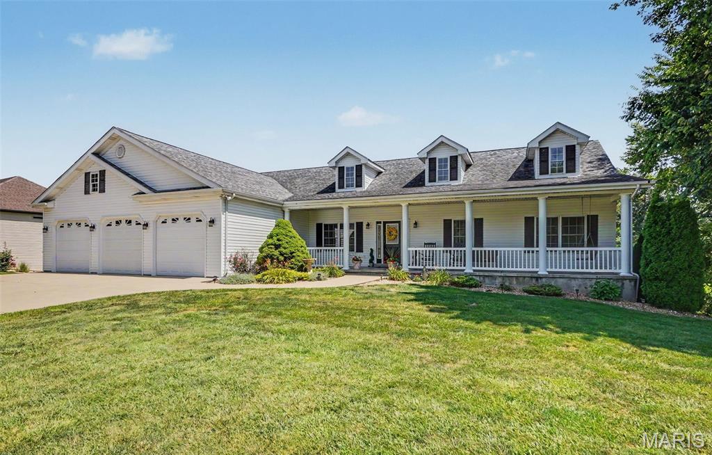 Luxury, space, and thoughtful design come together in this exceptional 6-bedroom, 3.5-bath ranch nestled on a beautifully landscaped 0.69-acre lot in the highly desirable Eastland Oaks community. From the moment you enter the impressive foyer, you'll appreciate the quality craftsmanship and attention to detail throughout. The spacious great room showcases soaring vaulted ceilings and a stunning see-through stone wood-burning fireplace that creates the perfect connection to the inviting California room, an ideal place to relax in every season. Designed with both entertaining and everyday living in mind, the gourmet kitchen features custom cabinetry with crown molding, granite countertops, tile backsplash, a large center island, premium appliances, custom range hood, and abundant storage. A formal dining room offers an elegant setting for family gatherings, while the nearby main-floor laundry room adds convenience. The private primary suite is a true retreat with vaulted ceilings, a charming bay window, and a luxurious ensuite featuring a tiled walk-in shower and double vanity. The finished lower level offers incredible flexibility with an expansive family room, stylish wet bar with dishwasher, three additional bedrooms, and a full bath with double vanity, perfect for overnight guests, a home office, or hobby space. Outside, enjoy nearly three-quarters of an acre with room to entertain, play, or simply unwind. Residents enjoy neighborhood amenities including a community pool and scenic walking trails; all while being conveniently located on the east side of Washington with easy access for commuters. With generous living space, upscale finishes, and an unbeatable location, this home offers the perfect blend of elegance, comfort, and functionality. Don't miss your opportunity to make this extraordinary property your next home!