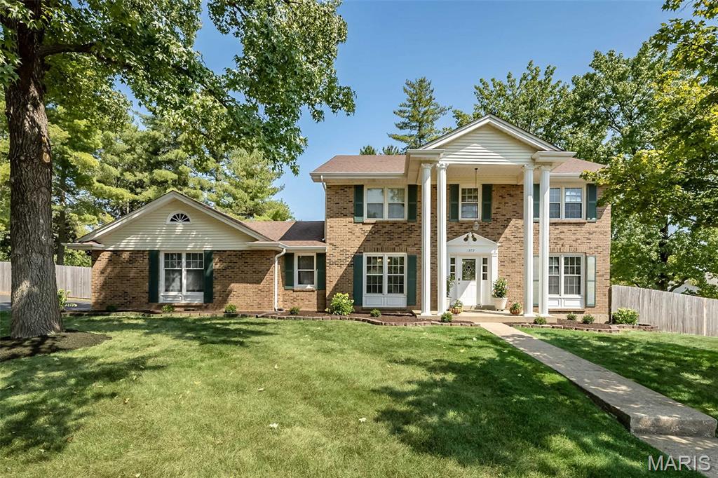 Discover this beautifully updated, stately two-story home in the heart of Chesterfield, offering five bedrooms, three bathrooms, and more than 4,000 square feet of finished living space. The homeowners have meticulously maintained and improved the property, blending elegance, functionality, and timeless appeal. Just inside, the formal dining room is on the left, while a sitting room or flexible home office is on the right. The family room features a wood-burning fireplace, a walk-behind bar, and newer hardwood floors. The eat in kitchen offers a generous amount of counter space, stainless steel appliances, a breakfast area, bay window and newer hardwood flooring. From the kitchen, step into a private backyard oasis with a fabulous pool—perfect for hot St. Louis summer days.
Upstairs are five bedrooms, including an exceptionally spacious primary suite with a walk-in closet and a beautifully updated bathroom featuring marble tile. The four additional bedrooms offer tons of closet space and share an updated full bathroom. The finished lower-level features two separate recreation areas, new luxury vinyl flooring, fresh paint, and storage areas. Outside, the main event is the large private in-ground pool with a diving board, large pool deck, fresh landscaping, and a mini basketball court, all creating an ideal setting for an active and relaxing lifestyle.
Additional features of this home include a main-floor laundry room, newer zoned HVAC (4 years) newer roof (10 years), a stately covered front porch, and side entry garage. Just minutes to major highways, shopping, top rated Parkway schools, you can’t beat the location and convenience. This beautiful home is ready for you to make it yours.