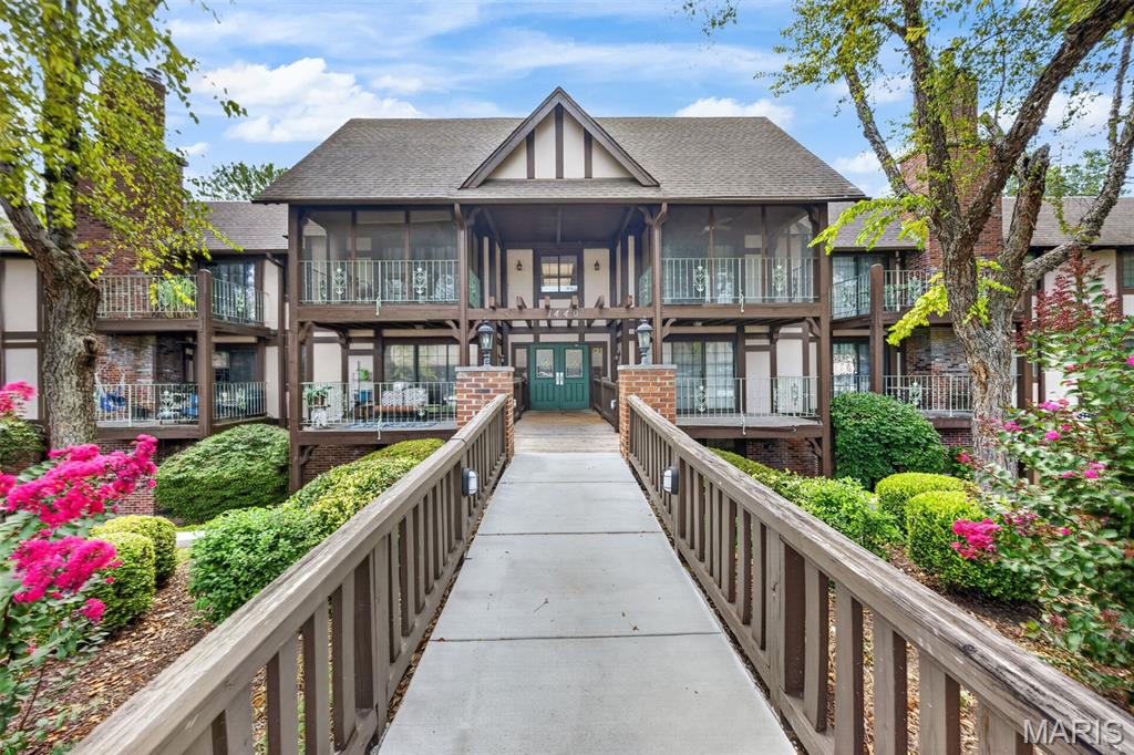 Welcome to Heritage Landing, where peaceful waterfront living meets low-maintenance convenience! This spacious 3-bedroom, 2-bath condominium offers the ease of main-level living with secure building access and an elevated covered balcony overlooking mature trees and the community pond.

Inside, you'll find a fresh, neutral interior featuring vinyl plank flooring throughout and freshly painted walls, creating a clean, move-in-ready space ready for your personal touch. The expansive open-concept living and dining area offers plenty of room to entertain, highlighted by a cozy brick gas fireplace and large sliding glass doors that fill the home with natural light.

The kitchen provides abundant cabinet and counter space, a functional layout, and overlooks the dining area, making everyday living and entertaining a breeze. 

An assigned covered parking space located directly across from the building's front entrance provides easy, convenient access in all seasons.

Step outside to your private covered balcony and enjoy peaceful views of the landscaped grounds, mature trees, and tranquil pond—a perfect spot for morning coffee or unwinding at the end of the day.