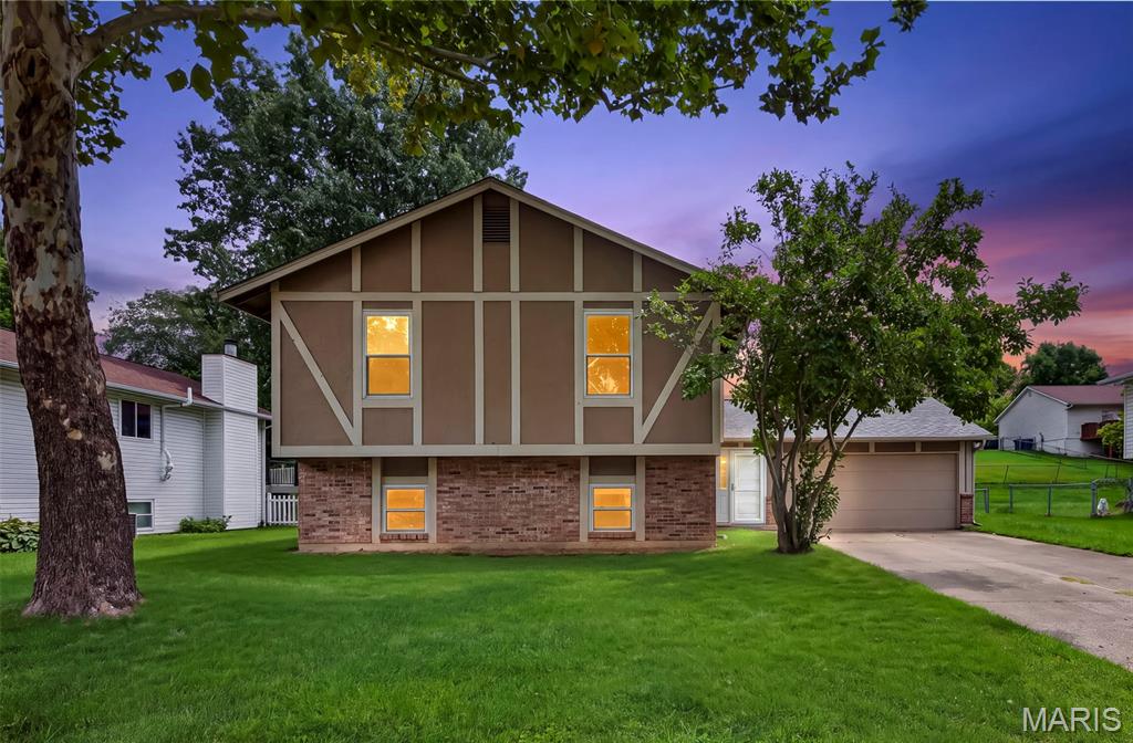 Welcome home to 1719 Foxglove Dr! This spacious multi-level home offers a versatile floor plan, and a fantastic location! The upper level features a large, open living, dining, and kitchen area—perfect for everyday living and entertaining. The living room boasts a vaulted ceiling, two skylights, and plenty of natural light. Three bedrooms and two full baths complete the upper level.
The lower level provides even more room to spread out with a spacious family room featuring laminate flooring and a wood-burning fireplace, plus an additional large en suite bedroom with a walk-in closet—ideal for guests, a home office, or additional living space. Step outside to enjoy the deck overlooking the fenced backyard, offering plenty of space to relax, play, or entertain. The oversized 2-car garage includes an additional 10x7 storage area for added convenience. Additional updates include a newer roof (2021), new front door (2026), and some newer windows throughout. Located close to the Page Extension and within walking distance of Wapelhorst Park, where you can enjoy the pool, tennis courts, soccer fields, baseball fields, trails, and more. With plenty of space inside and out, 1719 Foxglove Dr is ready for its next owner to make it HOME!