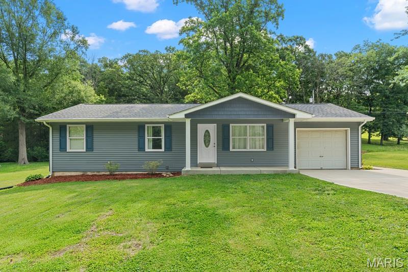 Updates galore primarily over the last five years! This all electric three-bedroom ranch home includes 200 AMP electric service, insulated tilt windows, ceramic flooring in kitchen, breakfast room, and both main floor baths. Updated cabinetry throughout, baths updated, roof replaced, vinyl siding, enclosed soffits, gutters, along with patio, sidewalk, and porch concrete work/replacement. Recessed can lighting in most every room along with paddle fans and solar tube lighting at two locations - one in the full hall bath on the main level along with an additional one located at the laundry area in the lower level! Primary bedroom includes private full bath with jetted tub, ceramic tile flooring and towel closet. Laundry area is located in the lower level that includes a stair system leading to the rear newly expanded concrete covered patio measuring 29x13 and equipped with three recessed can lights. A service door leads from the patio to the oversized one car garage which gives access to the kitchen. There are many conveniences included in this ready to move into home. A must see!!!