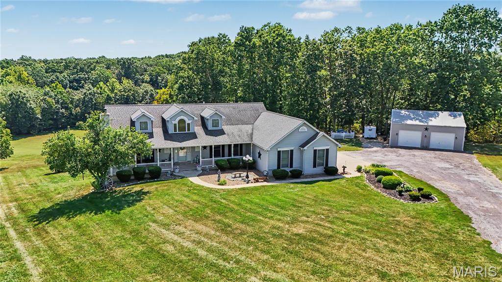 Rare opportunity to own this spacious custom built atrium ranch nestled on 4+ picturesque acres in a private cul-de-sac setting! Offering 2 main-floor bedrooms plus an additional sleeping room in the professionally finished walk-out lower level, this home delivers the perfect combination of space, privacy, modern updates, and peaceful country living.

Step inside to a bright, soaring foyer that welcomes you into an open and inviting floor plan. The spacious kitchen is a chef's dream, featuring gleaming granite countertops, a tastefully designed backsplash, stainless steel appliances, center island, and an abundance of cabinetry—perfect for both everyday living and entertaining. Just off the kitchen, the separate dining area provides access to the screened-in porch, where you can relax and enjoy views of the beautiful acreage.

The vaulted great room is a true centerpiece of the home, featuring a propane fireplace and an impressive wall of windows overlooking the backyard, filling the space with natural light and bringing the outdoors in. A spacious main-floor laundry room adds everyday convenience.

The primary suite offers its own private retreat with direct access to a balcony overlooking the acreage—the perfect spot to enjoy your morning coffee or unwind at the end of the day.

Downstairs, the professionally finished walk-out lower level greatly expands the home's living space with a large open family room, additional sleeping room, full bathroom, and generous storage space.

Outside, enjoy more than 4 acres of your own private oasis with plenty of room to relax, entertain, and enjoy nature. A large deck, screened-in porch, balcony, and detached garage make the outdoor space just as impressive as the interior.

Notable updates include HVAC (2019), roof (2021), granite countertops, kitchen flooring, lower-level carpeting, screened-in porch, and detached garage.

If you've been searching for peaceful country living without sacrificing space, comfort, or modern updates, 174 Denise Ct may be exactly what you've been waiting for!