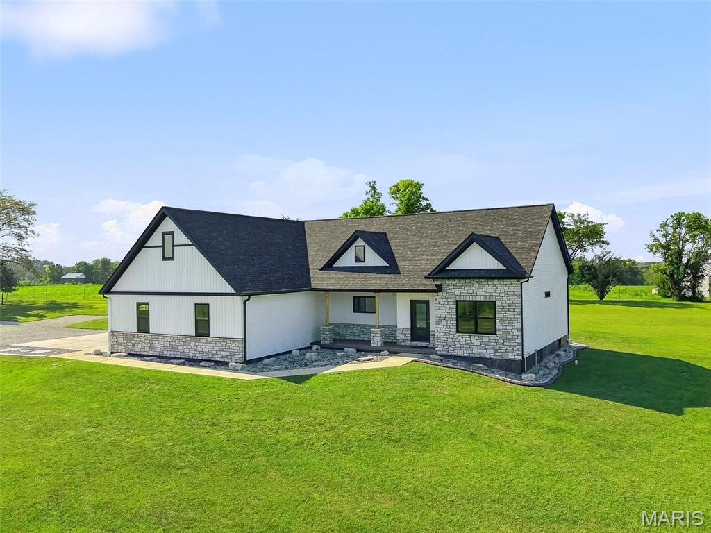 Welcome to 120 White Wildlife Rd in Silex! Situated on 5 beautiful acres, this spacious 3-bedroom, 2.5-bath home offers over 1,800 square feet of comfortable living space with a peaceful country setting. A long private driveway leads you home, offering plenty of privacy and room to enjoy the outdoors. Inside, you’ll find real hardwood, granite countertops, and a stunning floor-to-ceiling stone fireplace that serves as the centerpiece of the living area. With plenty of space inside and out, this property offers the country lifestyle you’ve been looking for while still providing convenient access to Highway 61 for an easy commute. Don’t miss your chance to make this 5-acre property your own!