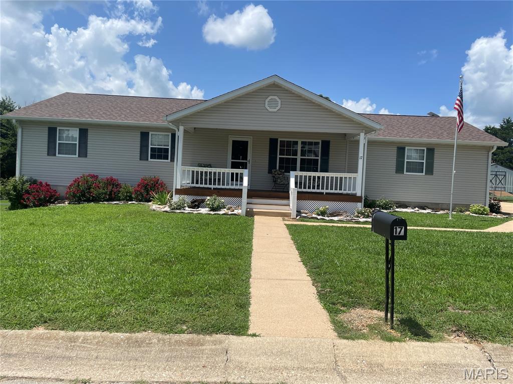 Custom built home in a nice subdivision.  Main level features 3 bedrooms; 2 bathrooms; kitchen/dining combo with island, appliances, bay window and door to rear, covered deck; nice size living room; cathedral ceiling between living room and kitchen/dining; can lighting throughout; laundry room with walk door to garage.  Full walkout basement features two nonconforming bedrooms (no window) and a large, unfinished area for storage.  Attached garage with automatic door opener.  Nice, covered porch on the front.  16X25 composite deck on the back with 16X14 covered, electric outlets and ceiling fan.  Fenced back yard for the pets.  Amazing sunset view of the farm behind this property.  There is a filtration system and ADT security system.  Recent updates include roof, hvac and water heater.  There are restrictions