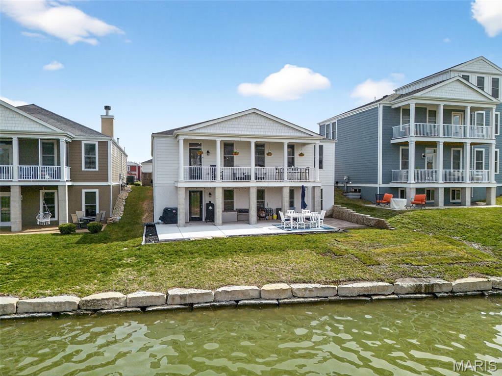 A Rare Waterfront Opportunity in New Town 

Welcome to a unique ranch home on a beautiful walkout waterfront lot in New Town. Just 4 years young, this move-in ready home offers the perfect combination of space, comfort, and stunning views.

4 Bedrooms | 3 Full Baths | Finished Walkout Lower Level | 4-Car Garage

Inside, you’ll love the open concept living area featuring a dream kitchen with a massive center island, breakfast bar, stainless steel appliances, tile backsplash, 42” cabinetry, two pantries, and even a pot filler at the stove.

The peaceful waterfront views from the main living area and the spacious primary suite create a relaxing atmosphere that feels like a vacation—except you get to enjoy it every day.

Step outside to the expansive covered deck, perfect for entertaining or simply unwinding while overlooking the water.

The finished lower level adds incredible extra living space with a recreation area, additional family room, “cocktail” happy hour space, 4th bedroom, and plenty of storage.

And the garage setup is truly unique:

2-car attached garage

2-car detached garage
(Not just a golf cart garage—two full garages!)

Located in New Town, you’ll also enjoy incredible community amenities that make this neighborhood one of a kind.

Showings begin Saturday, March 28 @ 9 am.