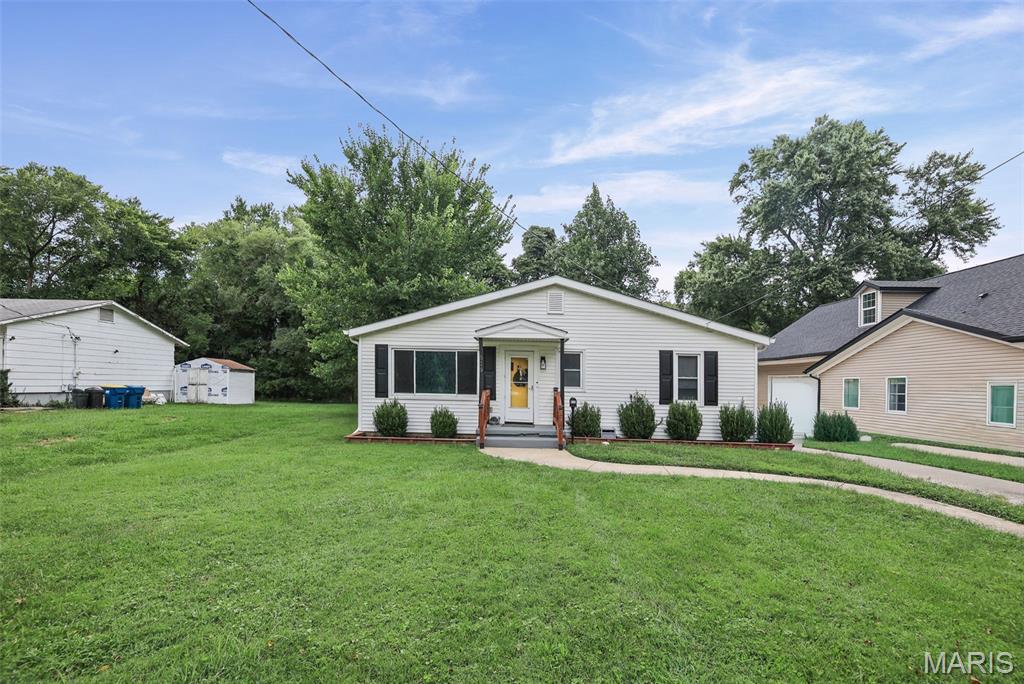 This property includes an updated single family home PLUS guest house / In-Law Suite! The main house features 3 bedrooms & 2 baths, with 1491 Sq Ft. Includes spacious living room, laundry room, eat in kitchen with tile backsplash & stainless steel appliances. Large primary bedroom has walk in closet, 3/4 primary bath & access to covered back porch. Guest house has 590 Sq Ft, with it's own electric meter; includes living room, kitchen, bonus room & 3/4 bathroom with laundry (stackable washer/dryer stays). Attached exterior storage space is a nice bonus. Private backyard is fenced, includes new patio & new partial concrete driveway. Both houses have a newer roof (with gutter guards), newer windows & newer water heater. Main house has newer HVAC system; both houses have newer mini-split heating & cooling system. Seller says the neighborhood is quiet & that deer frequently pass through! This is truly a unique property with many possibilities. Move in Ready! Located near downtown Edwardsville & Leclaire Park!