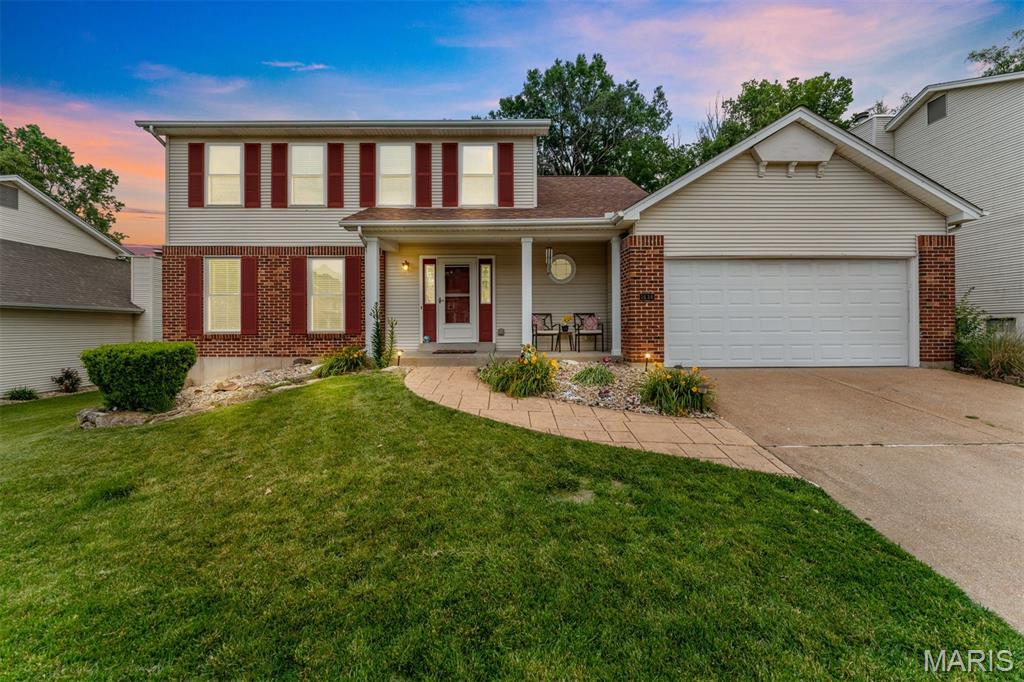 Welcome to this spacious and beautifully maintained  move-in ready home located in the highly sought-after Rockwood School District! Featuring a desirable open floor plan, this home is perfect for everyday living and entertaining alike. The eat-in kitchen offers new flooring, stainless steel appliances, granite countertops, and a bright breakfast room, all opening seamlessly to the spacious family room with beautiful floors, a bay window, and a cozy wood-burning fireplace. The formal living and dining room combination features newer flooring and oversized windows that fill the home with natural light. A main-floor laundry room and updated powder room add convenience and functionality. Upstairs, you’ll find four spacious bedrooms with new carpeting and generous closet space. The inviting primary suite features a coffered ceiling and private en-suite bath, creating the perfect retreat. Fresh paint throughout, stylish light fixtures, Champion windows, architectural shingle roof, and low-maintenance vinyl siding add tremendous value and appeal. Step outside to enjoy the beautifully landscaped backyard with a stamped concrete patio and partial fencing — ideal for relaxing or entertaining. Situated in a quiet subdivision with a fantastic location close to shopping, dining, parks, and major highways.